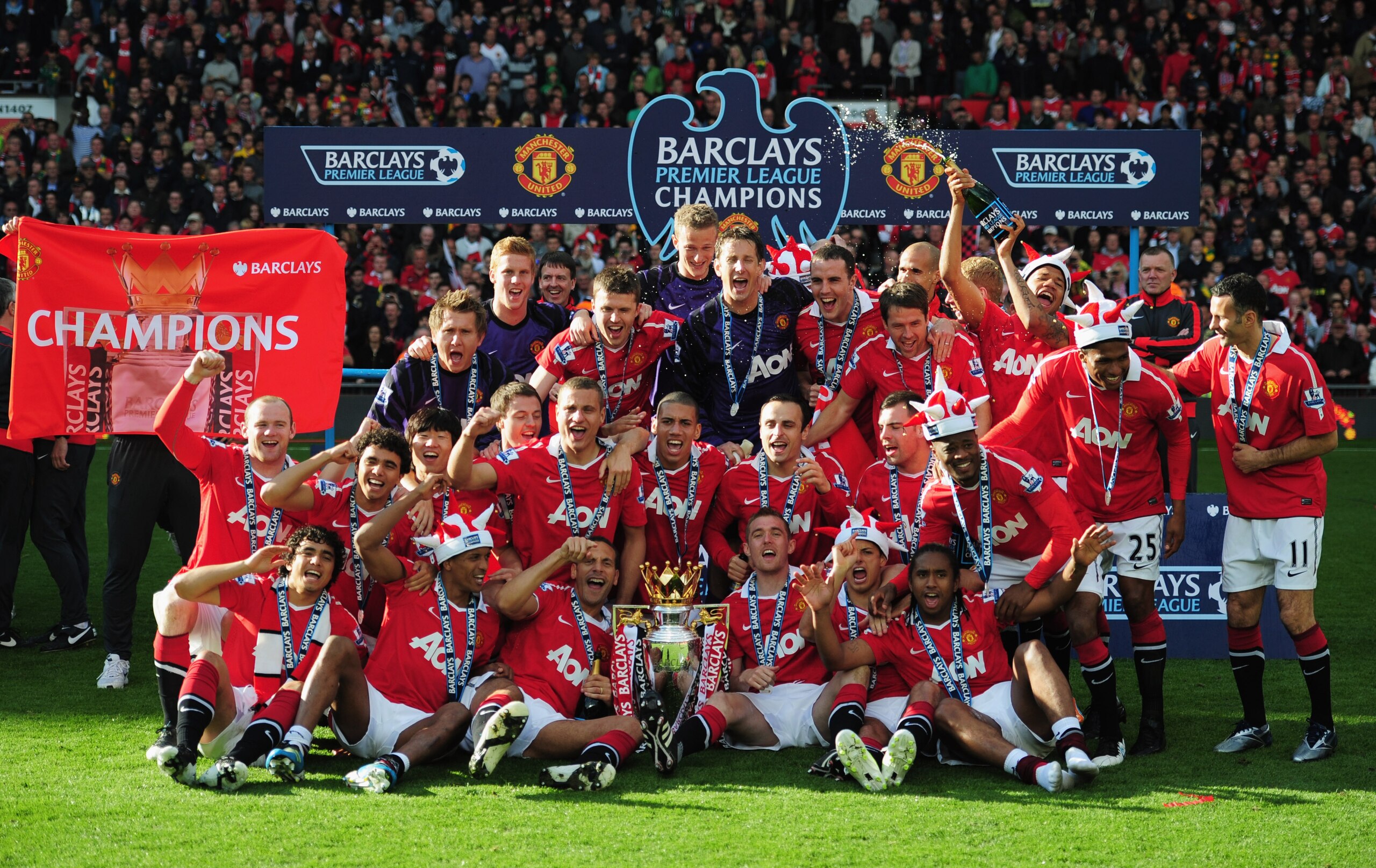 MANCHESTER, ENGLAND - MAY 22:  Manchester United celebrate with the Premier League trophy after the Barclays Premier League match between Manchester United and Blackpool at Old Trafford on May 22, 2011 in Manchester, England. Manchester United celebrate a