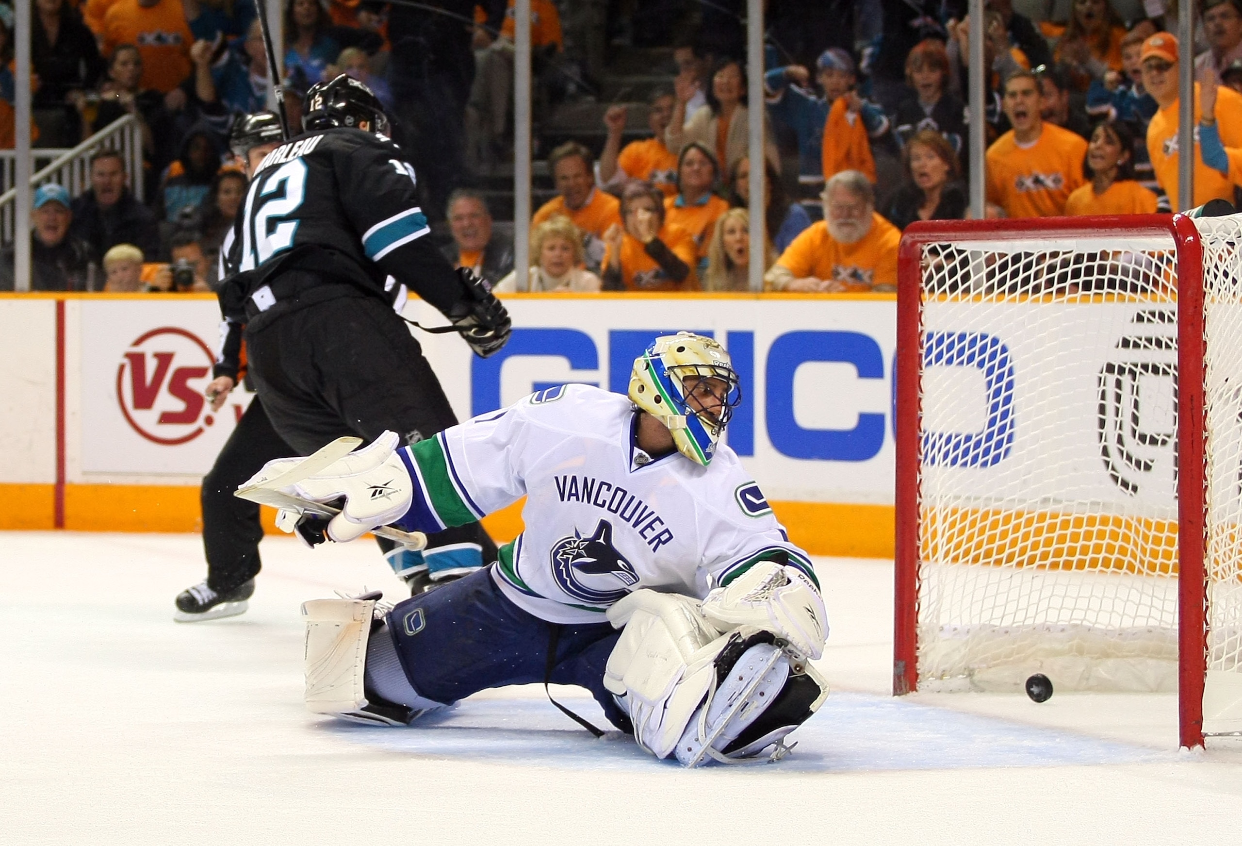 SAN JOSE, CA - MAY 20:  Goaltender Roberto Luongo #1 of the Vancouver Canucks looks back at the puck in the net after Patrick Marleau #12 of the San Jose Sharks' breakaway goal in the first period in Game Three of the Western Conference Finals during the