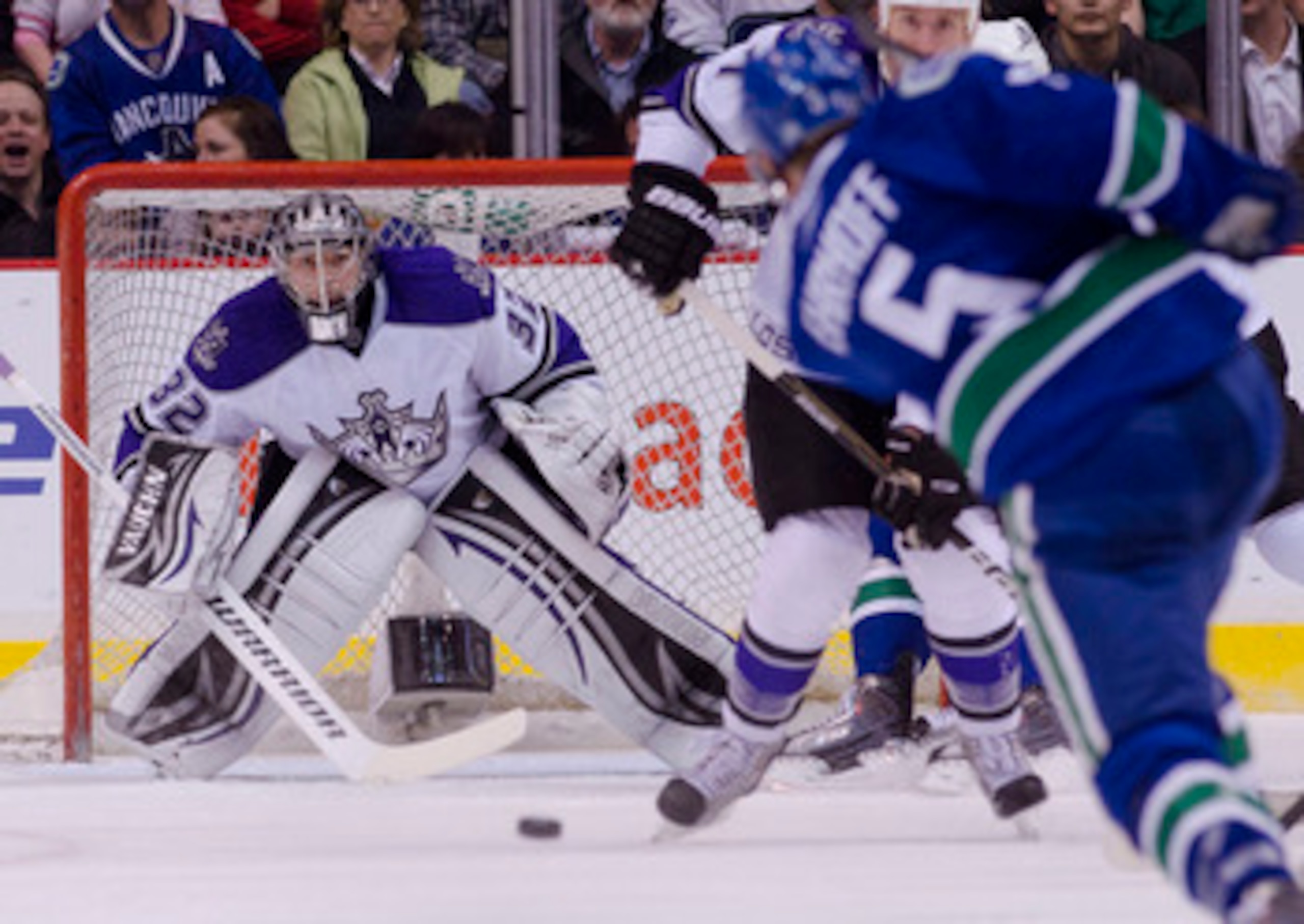 VANCOUVER, CANADA - MARCH 31: Goalie Jonathan Quick #32 of the Los Angeles Kings keeps an eye on the puck after being shot by Christian Ehrhoff #5 of the Vancouver Canucks during the first period in NHL action on March 31, 2011 at Rogers Arena in Vancouve