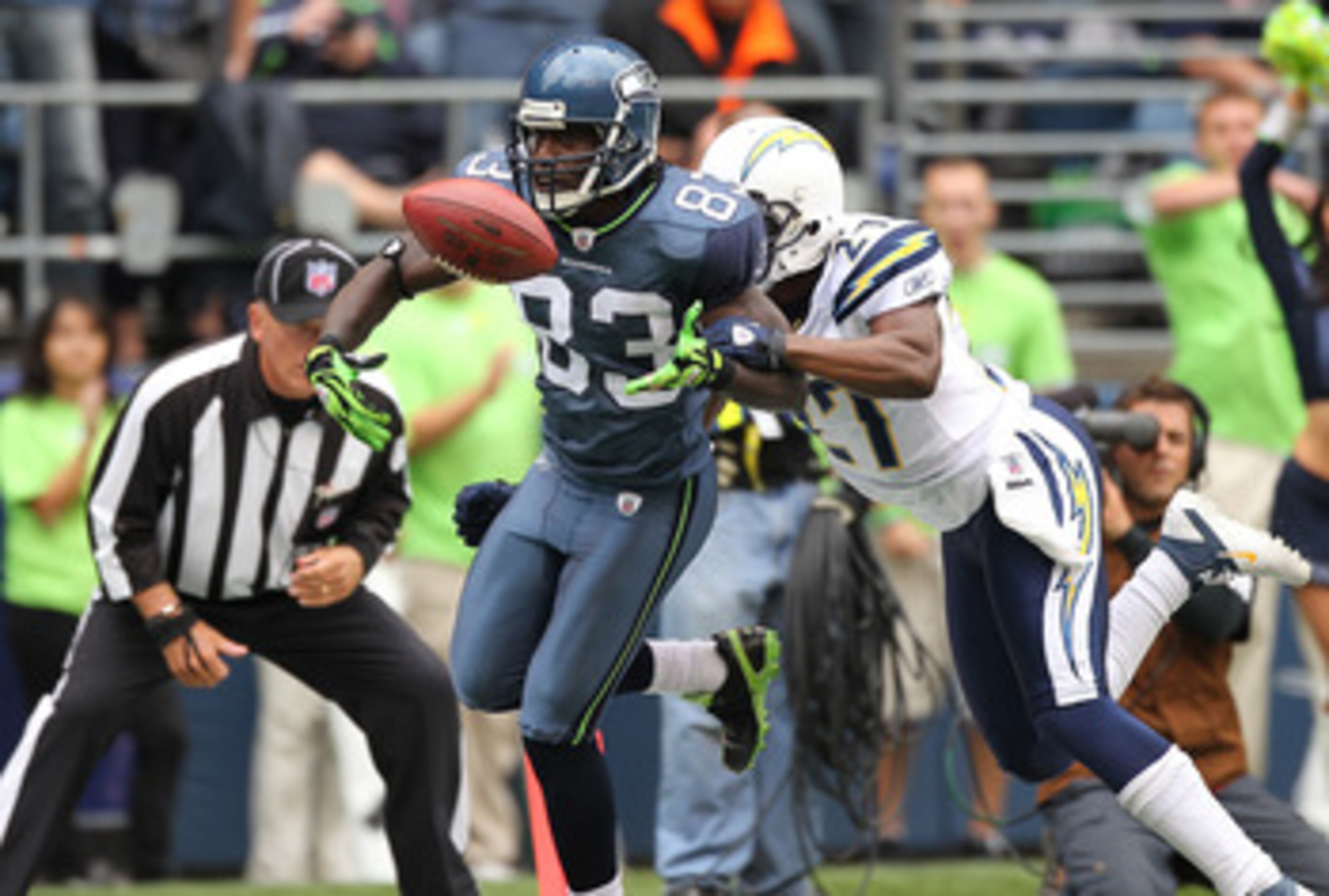 SEATTLE - SEPTEMBER 26:  Wide receiver Deion Branch #83 of the Seattle Seahawks looses possession of the ball as he crosses the goal line against Paul Oliver #27 of the San Diego Chargers at Qwest Field on September 26, 2010 in Seattle, Washington. The to