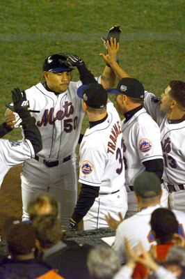 24 Oct 2000:  #50 Benny Agbayani of the New York Mets is congratulated as he heads into the dugout after leaving the game to be replaced by Joe McEwing in the 8th inning against the New York Yankees during Game 3 of the MLB World Series at Shea Stadium in