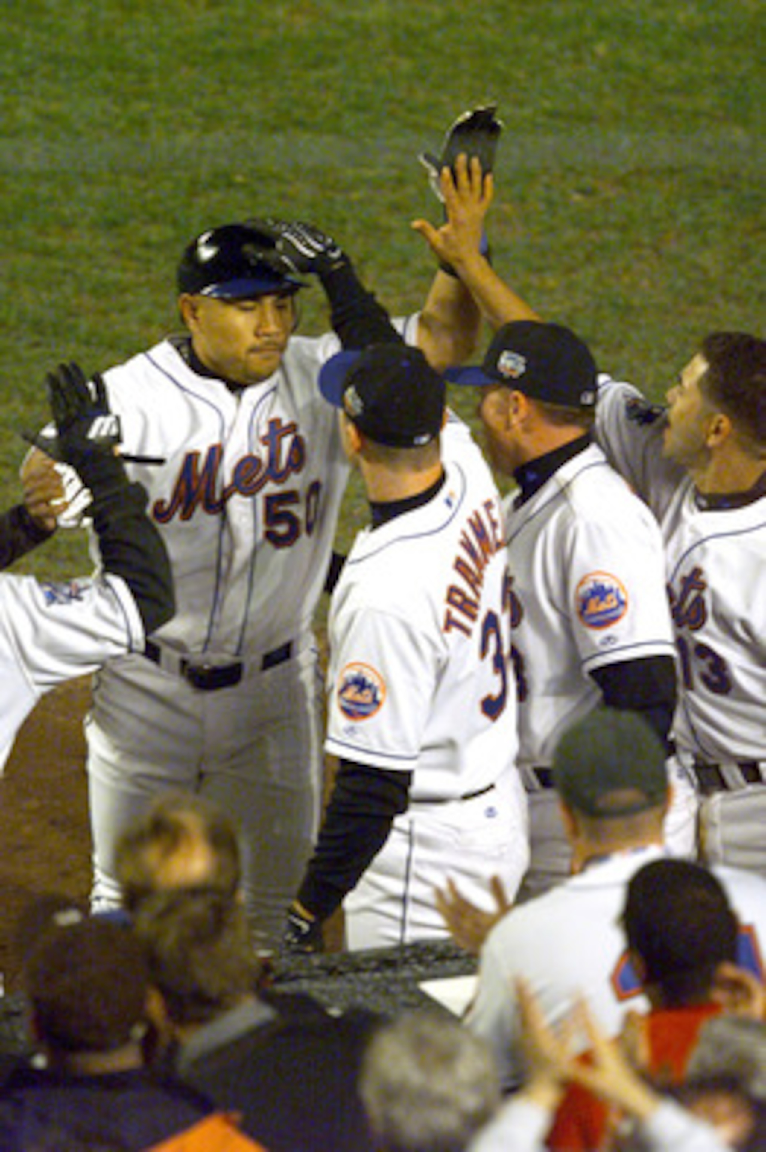 24 Oct 2000: #50 Benny Agbayani of the New York Mets is congratulated as he heads into the dugout after leaving the game to be replaced by Joe McEwing in the 8th inning against the New York Yankees during Game 3 of the MLB World Series at Shea Stadium in 24 Oct 2000: #50 Benny Agbayani of the New York Mets is congratulated as he heads into the dugout after leaving the game to be replaced by Joe McEwing in the 8th inning against the New York Yankees during Game 3 of the MLB World Series at Shea Stadium in