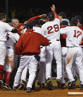 BOSTON - OCTOBER 4:  Outfielder Trot Nixon of the Boston Red Sox is congratulated by his teammates after hitting an 11th inning walk-off homerun against the Oakland Athletics during game three of the American League Division Series at Fenway Park on Octob