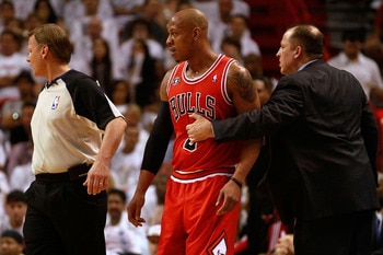 MIAMI, FL - MAY 22:  Head coach Tom Thibodeau of the Chicago Bulls holds back Keith Bogans against the Miami Heat in Game Three of the Eastern Conference Finals during the 2011 NBA Playoffs on May 22, 2011 at American Airlines Arena in Miami, Florida.  NO