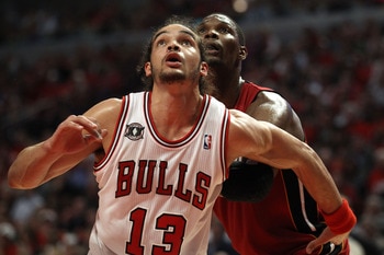 CHICAGO, IL - MAY 18:  Joakim Noah #13 of the Chicago Bulls fights for rebound position against Chris Bosh #1 of the Miami Heat in Game Two of the Eastern Conference Finals during the 2011 NBA Playoffs on May 18, 2011 at the United Center in Chicago, Illi