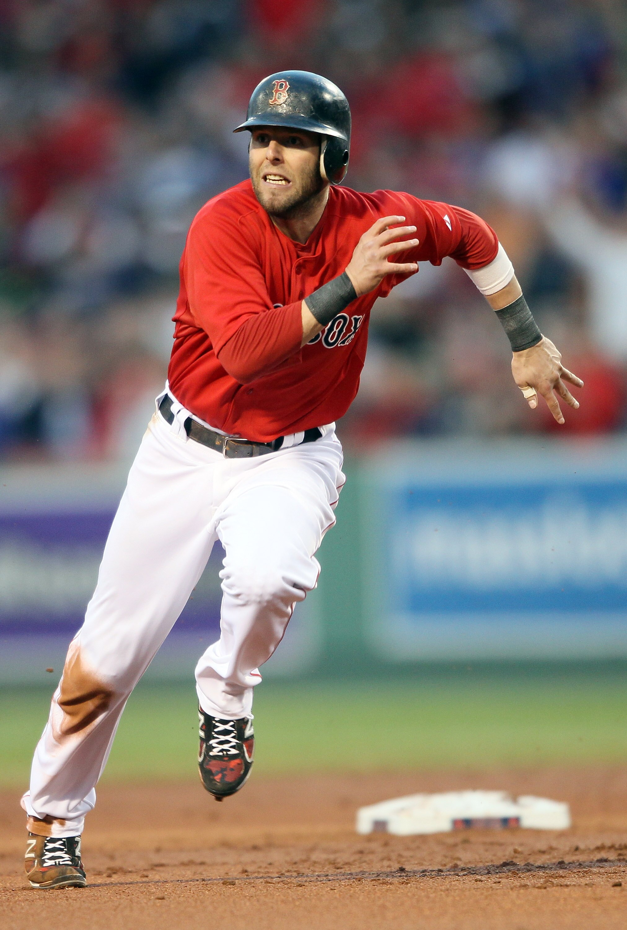 BOSTON, MA - MAY 20:  Dustin Pedroia #15 of the Boston Red Sox heads for third against the Chicago Cubs on May 20, 2011 at Fenway Park in Boston, Massachusetts.on May 20, 2011 at Fenway Park in Boston, Massachusetts. The Chicago Cubs and the Boston Red So