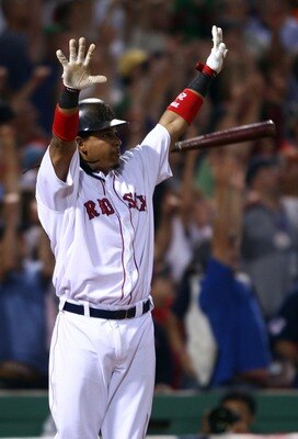 BOSTON - OCTOBER 06:  Manny Ramirez #24 of  the Boston Red Sox celebrates his game-winning home run in the bottom of the ninth inning against the Los Angeles Angels of Anaheim during game two of the American League Division Series on October 6, 2007 at Fe