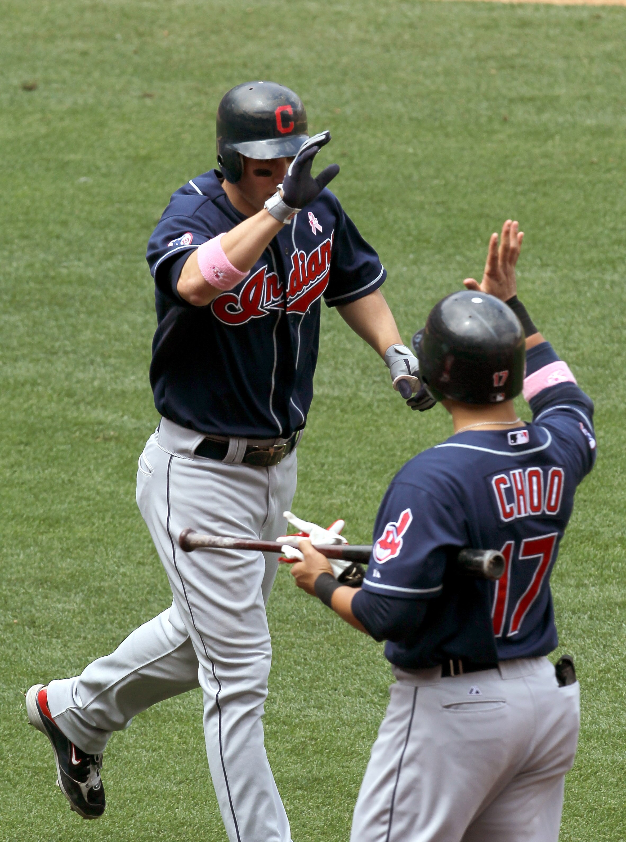 ANAHEIM, CA - MAY 8:  Grady Sizemore #24 of the the Cleveland Indians is greeted by Shin-Soo Choo #17 after his solo home run in the fifth inning against the Los Angeles Angels of Anaheim on May 8, 2011 at Angel Stadium in Anaheim, California.  (Photo by