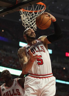 CHICAGO, IL - MAY 10: Carlos Boozer #5 of the Chicago Bulls grabs a rebound against the Atlanta Hawks in Game Five of the Eastern Conference Semifinals in the 2011 NBA Playoffs at the United Center on May 10, 2011 in Chicago, Illinois. NOTE TO USER: User 