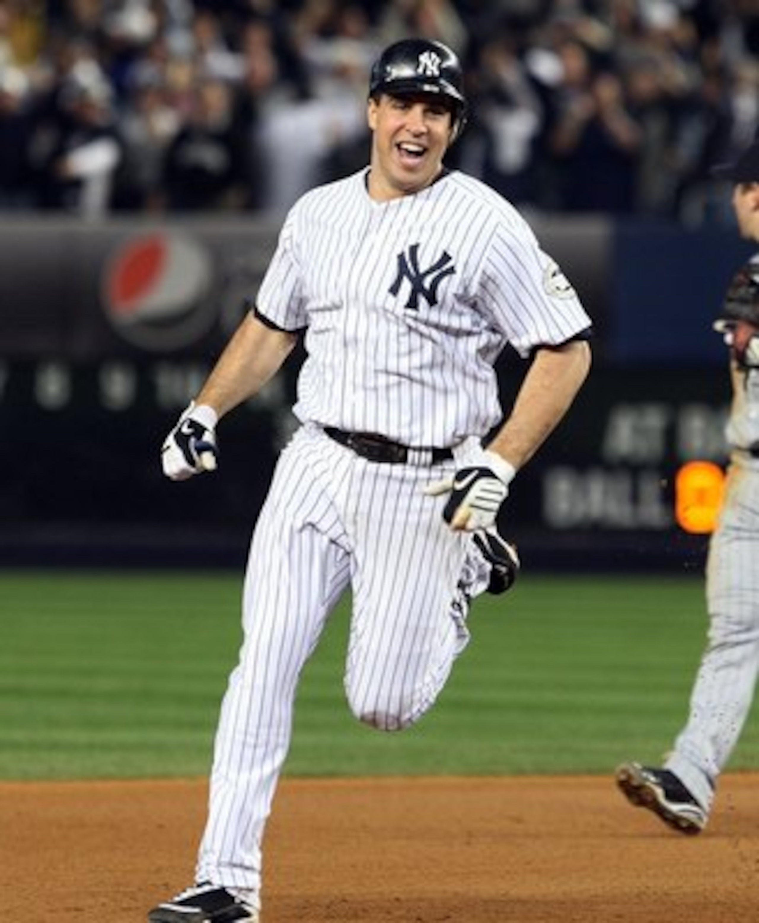 NEW YORK - OCTOBER 09: Mark Teixeira #25 of the New York Yankees celebrates as he runs past Nick Punto #8 after hitting a walk off home run in the eleventh inning against the Minnesota Twins in Game Two of the ALDS during the 2009 MLB Playoffs at Yankee S NEW YORK - OCTOBER 09: Mark Teixeira #25 of the New York Yankees celebrates as he runs past Nick Punto #8 after hitting a walk off home run in the eleventh inning against the Minnesota Twins in Game Two of the ALDS during the 2009 MLB Playoffs at Yankee S