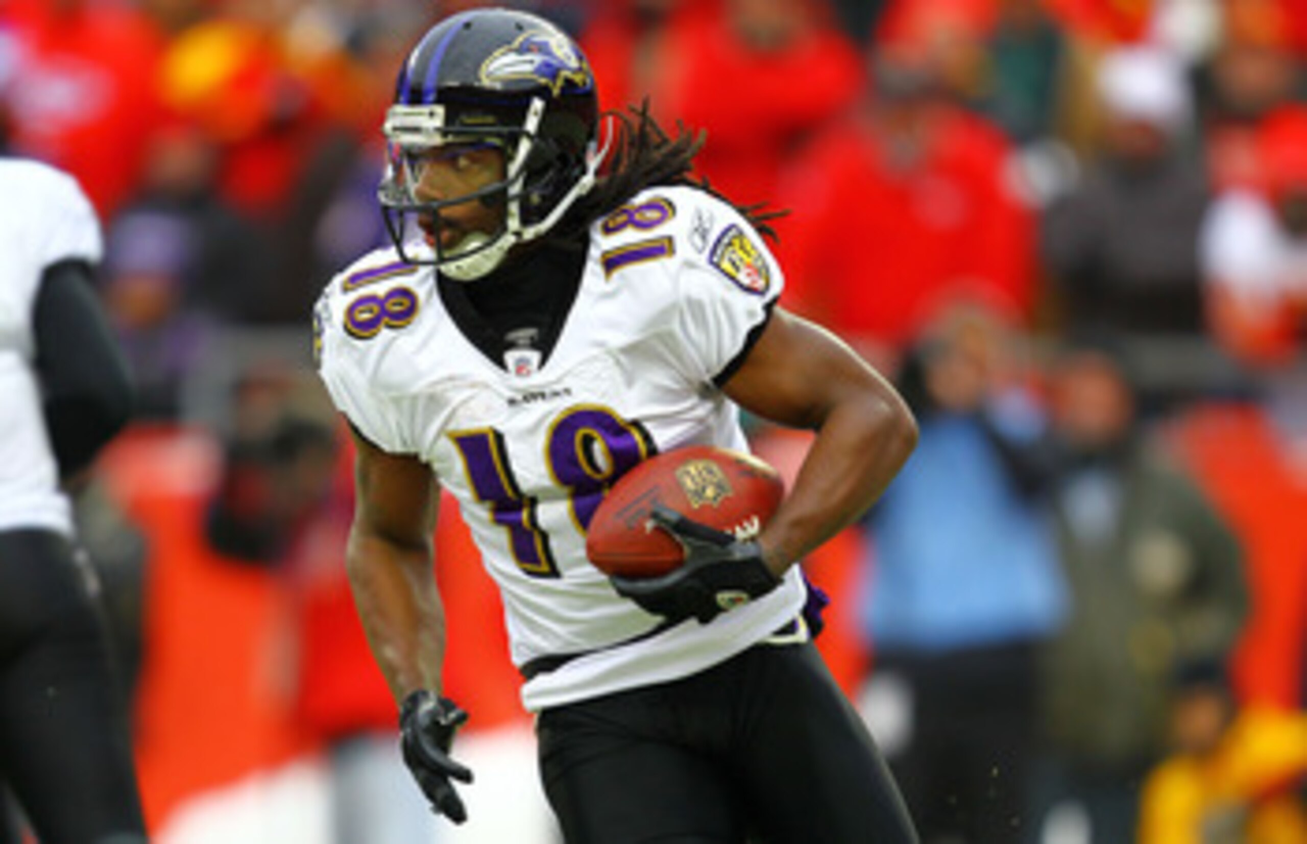 KANSAS CITY, MO - JANUARY 09:  Wide receiver Donte' Stallworth #18 of the Baltimore Ravens runs with the ball on a reverse against the Kansas City Chiefs during their 2011 AFC wild card playoff game at Arrowhead Stadium on January 9, 2011 in Kansas City, 