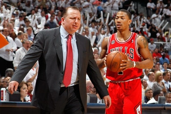 ATLANTA, GA - MAY 12:  Derrick Rose #1 walks off the court as Tom Thibodeau of the Chicago Bulls reacts after calling a timeout against the Atlanta Hawks in Game Six of the Eastern Conference Semifinals in the 2011 NBA Playoffs at Phillips Arena on May 12
