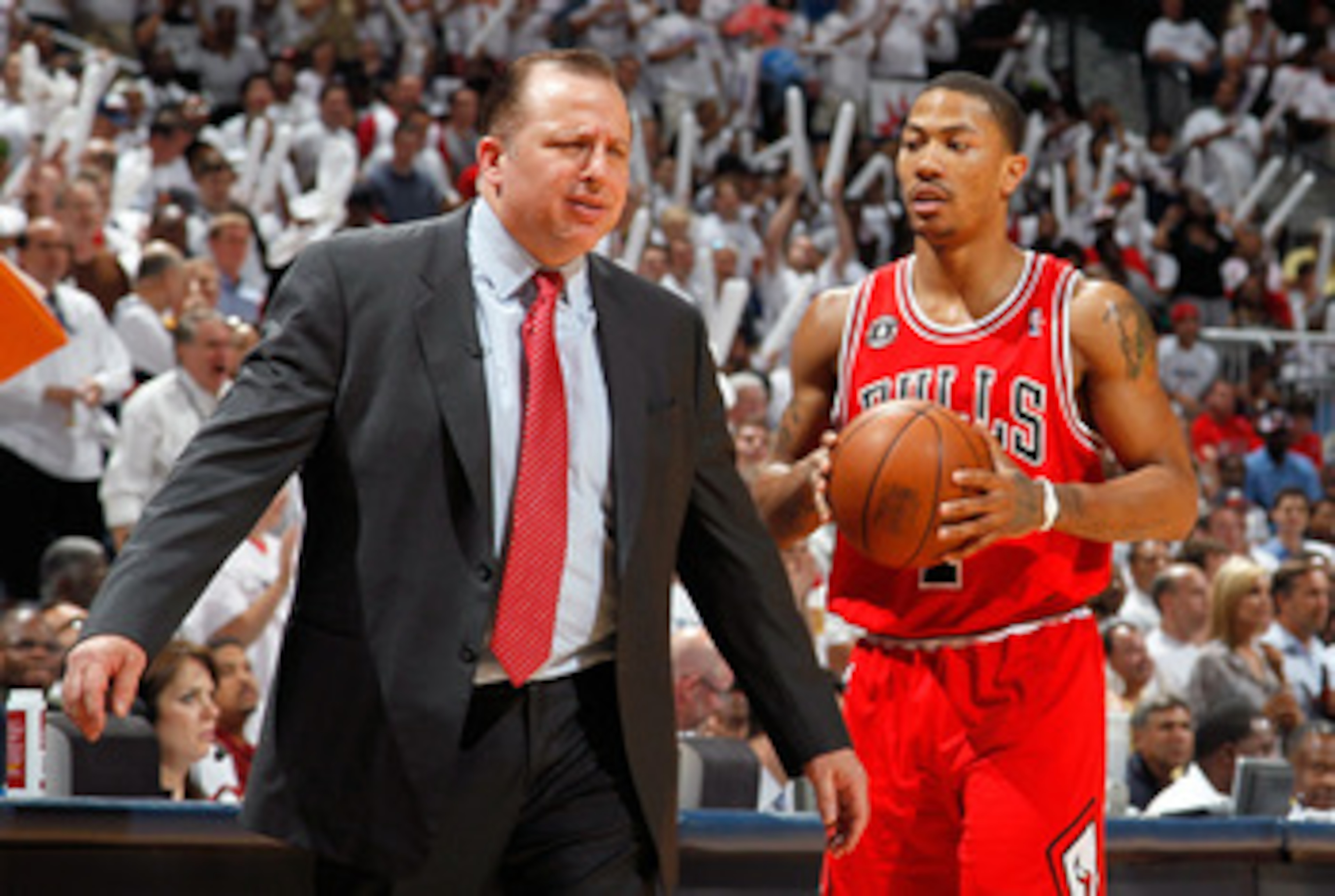 ATLANTA, GA - MAY 12:  Derrick Rose #1 walks off the court as Tom Thibodeau of the Chicago Bulls reacts after calling a timeout against the Atlanta Hawks in Game Six of the Eastern Conference Semifinals in the 2011 NBA Playoffs at Phillips Arena on May 12