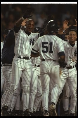 9 Oct 1996:  New York Yankees players congratulate Bernie Williams on his game-winning home run during a championship game against the Baltimore Orioles at Yankee Stadium in New York City, New York.  The Yankees won the game, 5-4. Mandatory Credit: Al Bel