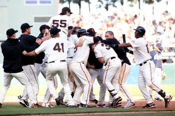 SAN FRANCISCO - APRIL 09:  Aaron Rowand #33 of the San Francisco Giants celebrates with teammates after hitting the game winning single in the 13th inning against the Atlanta Braves on Opening Day at AT&T Park on April 9, 2010 in San Francisco, California