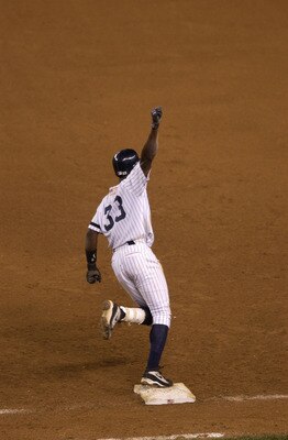 21 Oct 2001:  Alfonso Soriano of the New York Yankees celebrates as he completes a 2-run home run to win the American League Championship Game 4  against the Seattle Mariners at Yankee Stadium in the Bronx, New York . The Yankees won 3-1. DIGITAL IMAGE . 