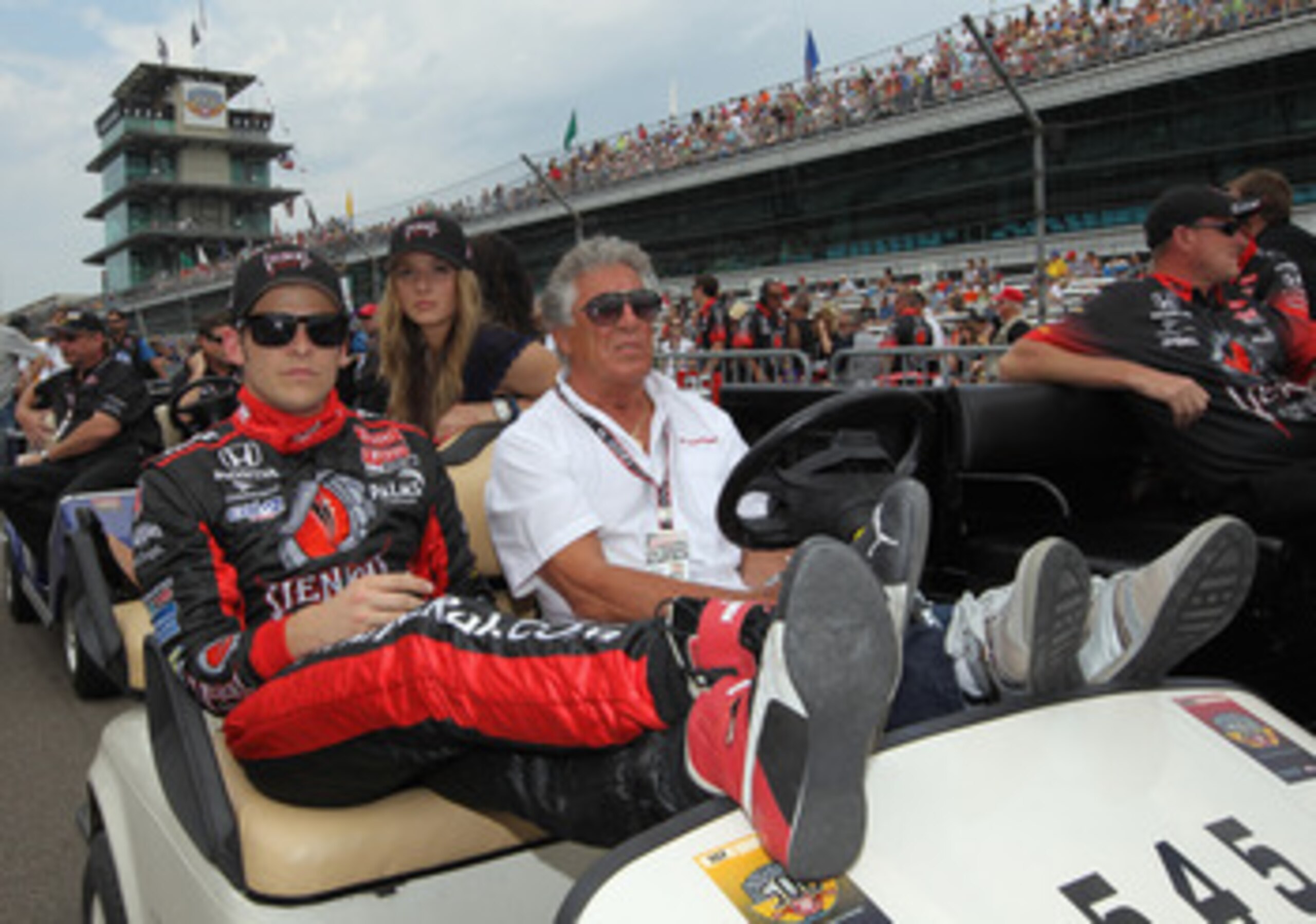 INDIANAPOLIS, IN - MAY 22:  Marco Andretti, driver of the #26 Team Venom Dallara Honda, sits beside grandfather, Mario Andretti, as he waits to qualify for the Indianapolis 500 on May 22, 2011 at Indianapolis Motor Speedway in Indianapolis, Indiana.  (Pho