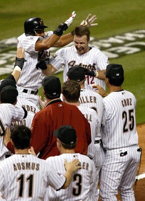 HOUSTON - OCTOBER 18:  Jeff Kent #12 of the Houston Astros celebrates with teammates after hitting a three-run home run to defeat the St. Louis Cardinals 3-0 in the bottom of the ninth inning in Game 5 of the National League Championship Series October 18