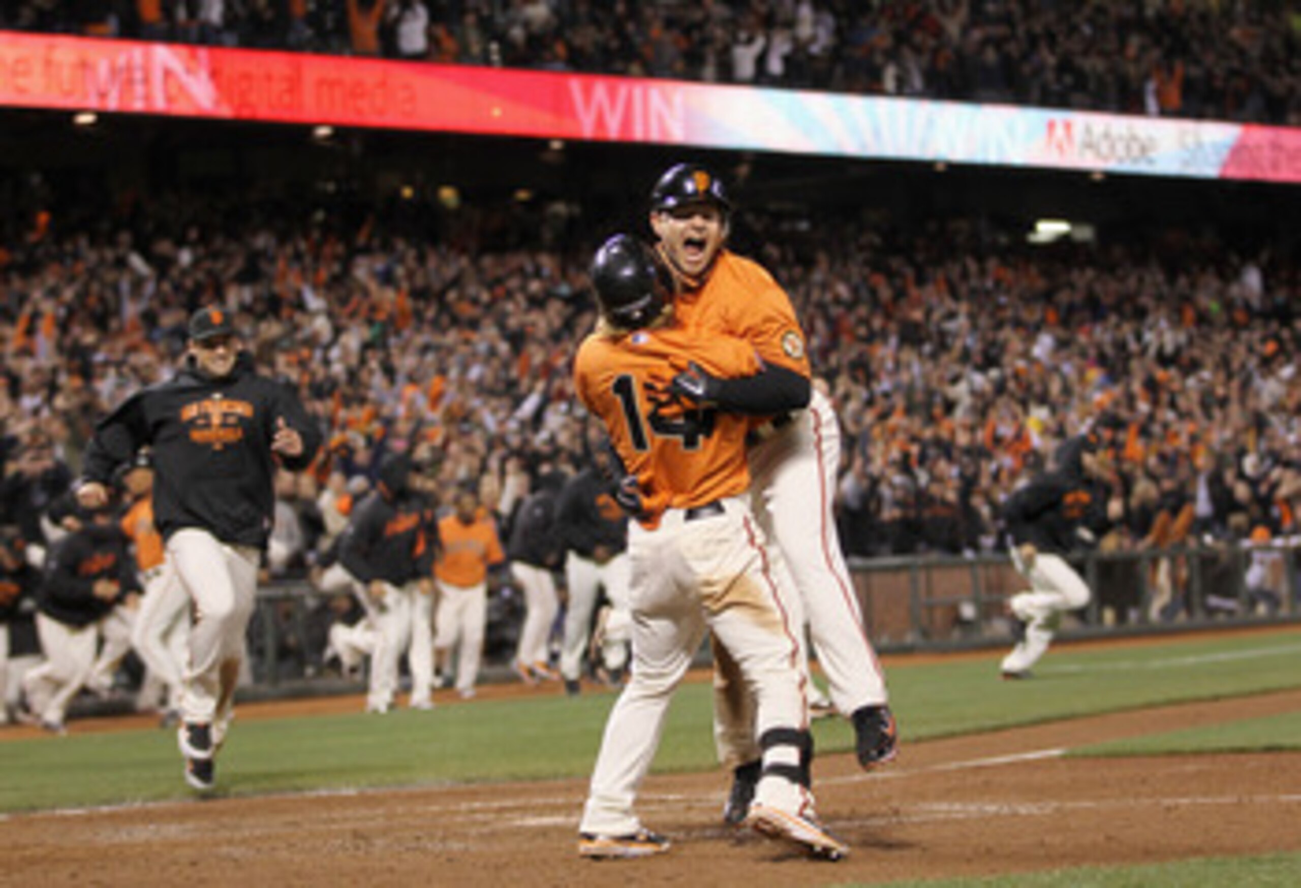 SAN FRANCISCO, CA - MAY 06: Cody Ross #13 and Mike Fontenot #14 of the San Francisco Giants celebrate after Ross scored the winning run on a hit by Freddy Sanchez #21 in the bottom of the ninth inning against the Colorado Rockies at AT&T Park on May 6, 2 SAN FRANCISCO, CA - MAY 06: Cody Ross #13 and Mike Fontenot #14 of the San Francisco Giants celebrate after Ross scored the winning run on a hit by Freddy Sanchez #21 in the bottom of the ninth inning against the Colorado Rockies at AT&T Park on May 6, 2