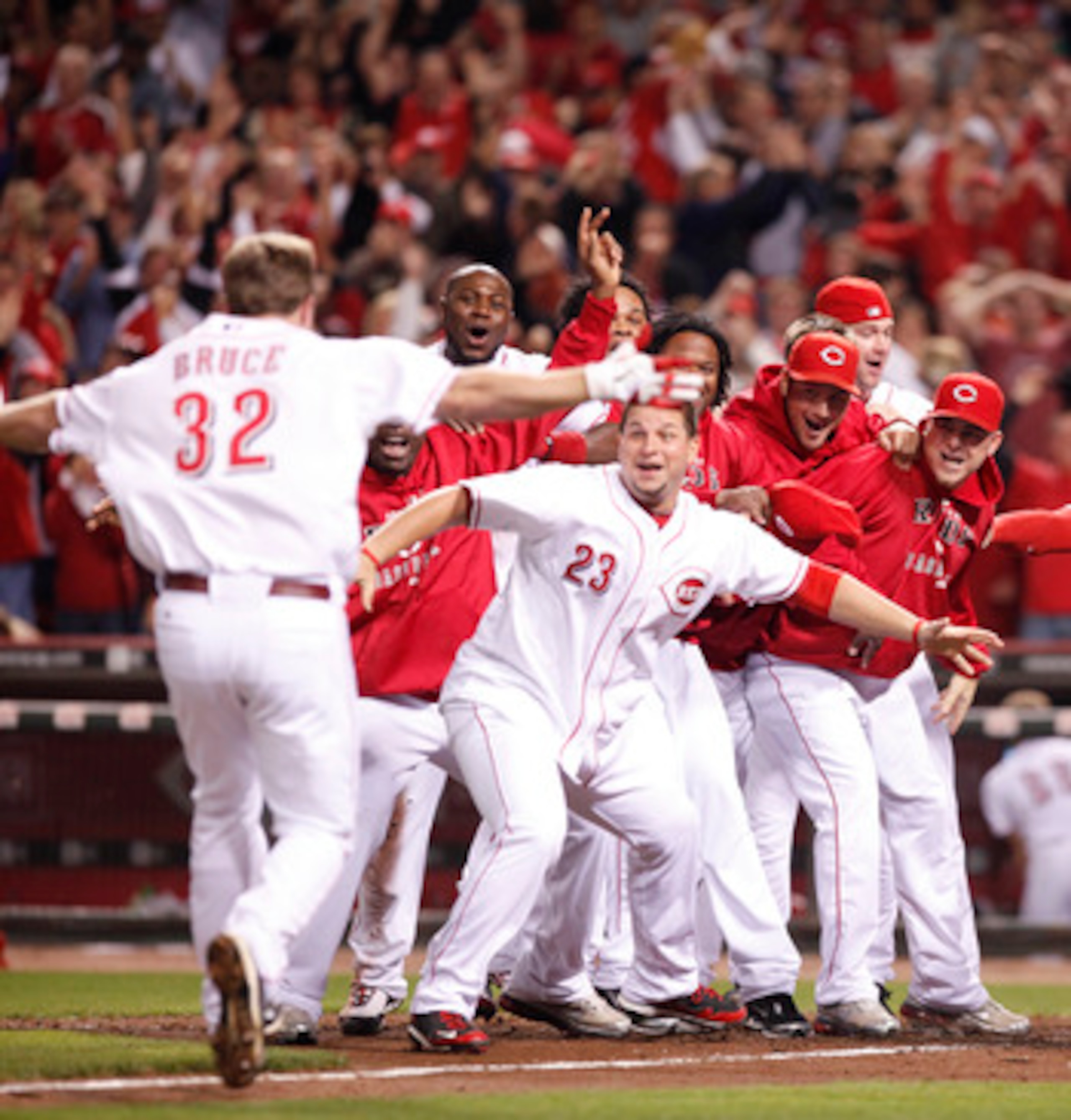 CINCINNATI, OH - SEPTEMBER 28: The Cincinnati Reds celebrate Jay Bruce's walk off home run against the Houston Astros at Great American Ball Park on September 28, 2010 in Cincinnati, Ohio. The Reds won 3-2 to clinch the NL Central Division title. (Photo b CINCINNATI, OH - SEPTEMBER 28: The Cincinnati Reds celebrate Jay Bruce's walk off home run against the Houston Astros at Great American Ball Park on September 28, 2010 in Cincinnati, Ohio. The Reds won 3-2 to clinch the NL Central Division title. (Photo b