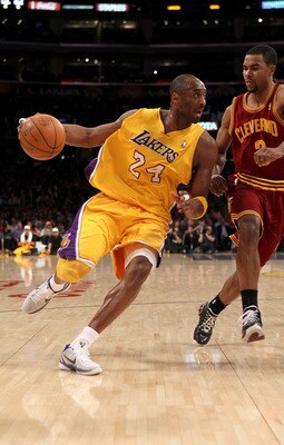 LOS ANGELES, CA - JANUARY 11:  Kobe Bryant #24 of the Los Angeles Lakers drives against Ramon Sessions #3 of the Cleveland Cavaliers at Staples Center on January 11, 2011 in Los Angeles, California.  The Lakers won 112-57.  NOTE TO USER: User expressly ac