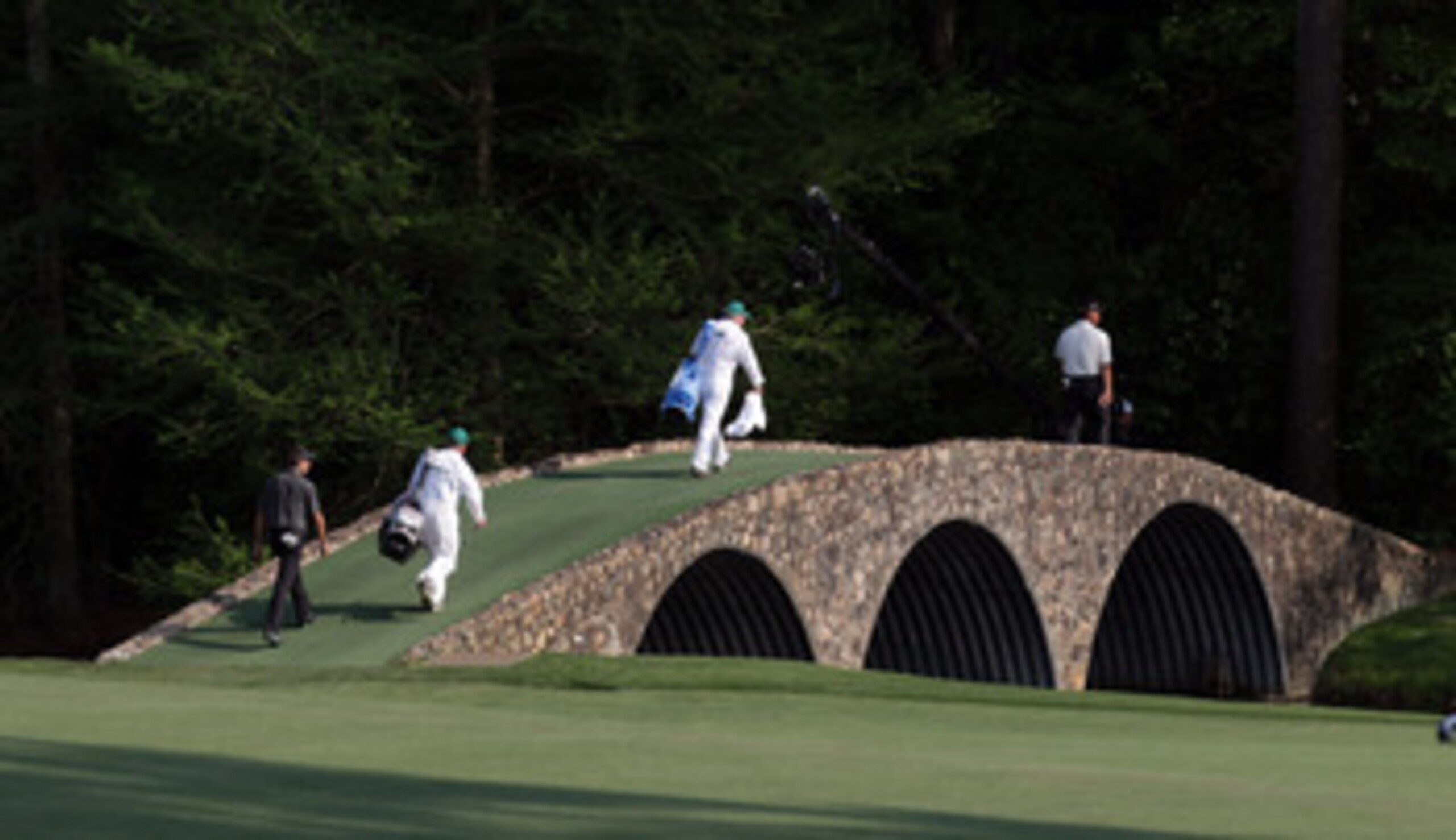 AUGUSTA, GA - APRIL 10:  Charl Schwartzel of South Africa makes his way over Hogan Bridge during the final round of the 2011 Masters Tournament at Augusta National Golf Club on April 10, 2011 in Augusta, Georgia.  (Photo by Ross Kinnaird/Getty Images for 