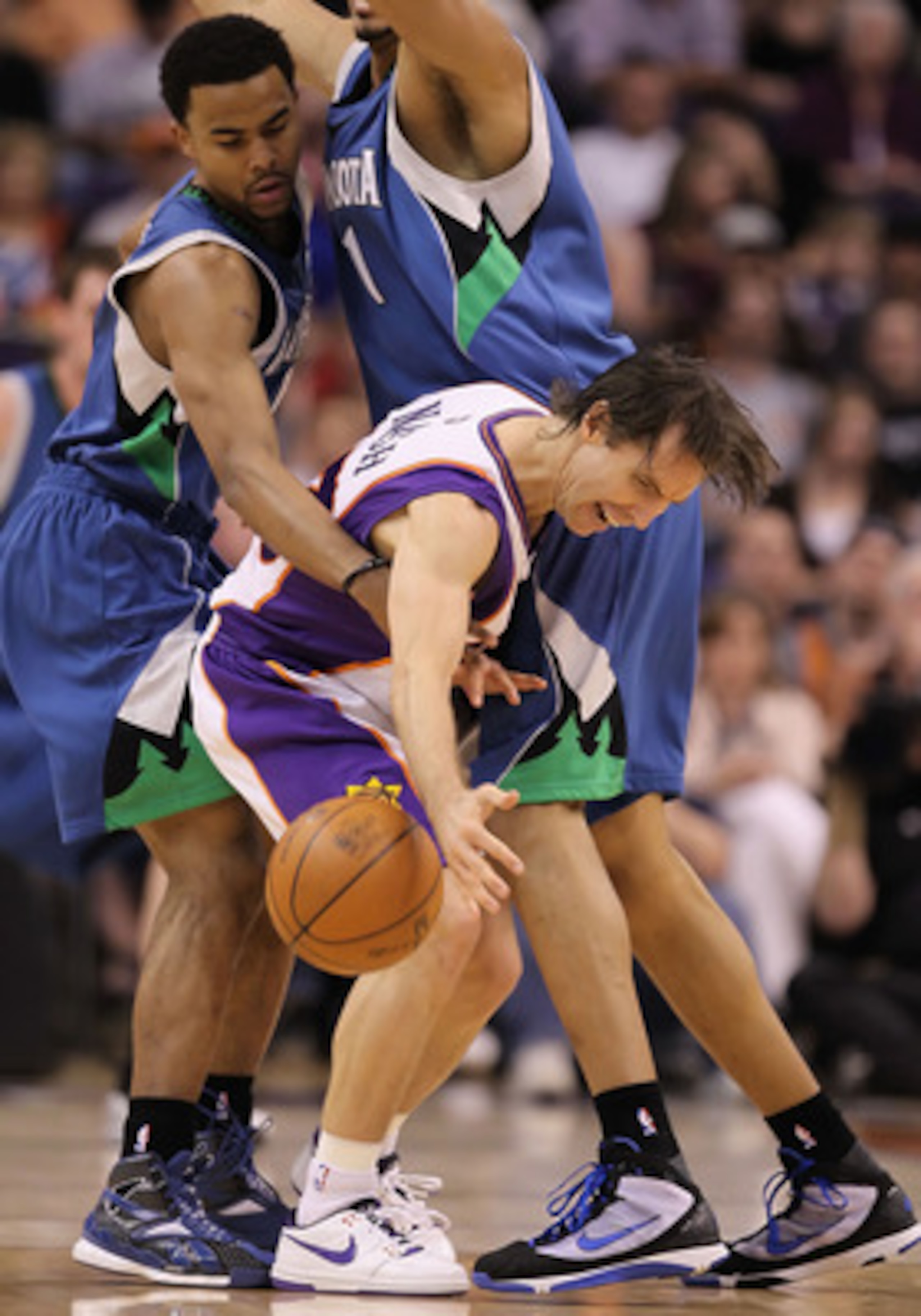 PHOENIX - MARCH 16:  Steve Nash #13 of the Phoenix Suns looses control on the ball while being guarded by Ramon Sessions #7 of the Minnesota Timberwolves during the NBA game at US Airways Center on March 16, 2010 in Phoenix, Arizona. The Suns defeated the