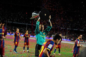 BARCELONA, SPAIN - MAY 15:  Goalkeeper Victor Valdes of FC Barcelona holds up the La Liga trophy after the La Liga match between Barcelona and Deportivo La Coruna at Camp Nou Stadium on May 15, 2011 in Barcelona, Spain.  (Photo by David Ramos/Getty Images