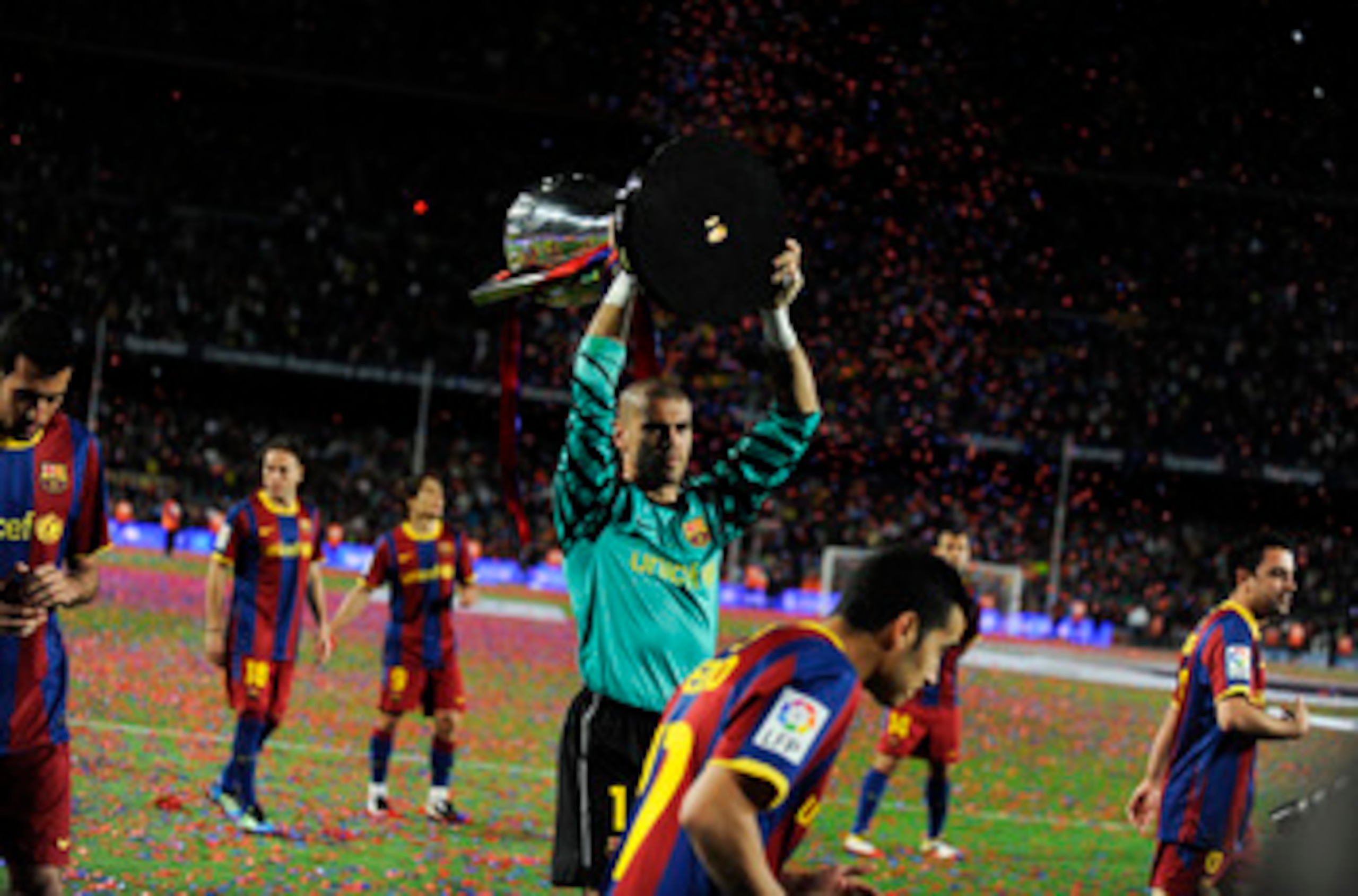 BARCELONA, SPAIN - MAY 15:  Goalkeeper Victor Valdes of FC Barcelona holds up the La Liga trophy after the La Liga match between Barcelona and Deportivo La Coruna at Camp Nou Stadium on May 15, 2011 in Barcelona, Spain.  (Photo by David Ramos/Getty Images