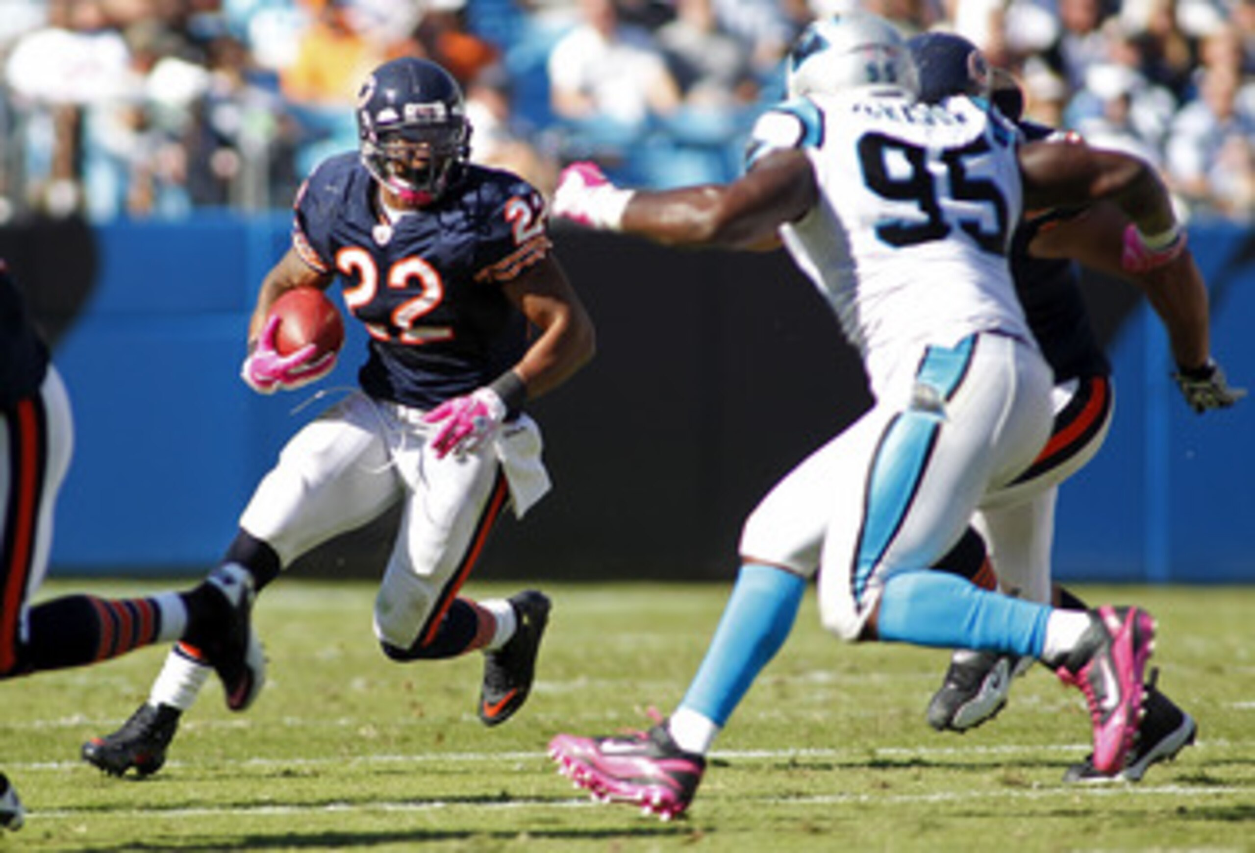 CHARLOTTE, NC - OCTOBER 10: Running back Matt Forte #22 of the Chicago Bears runs with the ball as defensive end Charles Johnson #95 of the Carolina Panthers defends at Bank of America Stadium on October 10, 2010 in Charlotte, North Carolina. (Photo by Ge CHARLOTTE, NC - OCTOBER 10: Running back Matt Forte #22 of the Chicago Bears runs with the ball as defensive end Charles Johnson #95 of the Carolina Panthers defends at Bank of America Stadium on October 10, 2010 in Charlotte, North Carolina. (Photo by Ge