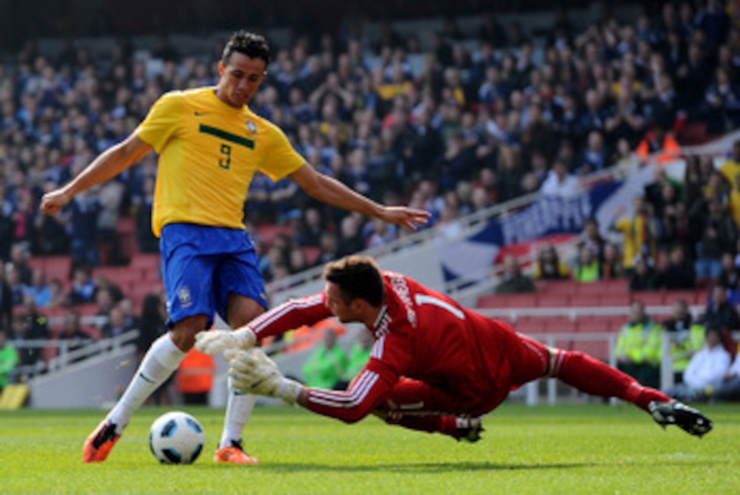 LONDON, ENGLAND - MARCH 27:   Leandro Damiao of Brazil has his effort stopped by Allan McGregor of Scotland during the International friendly match between Brazil and Scotland at Emirates Stadium on March 27, 2011 in London, England.  (Photo by Mike Hewit