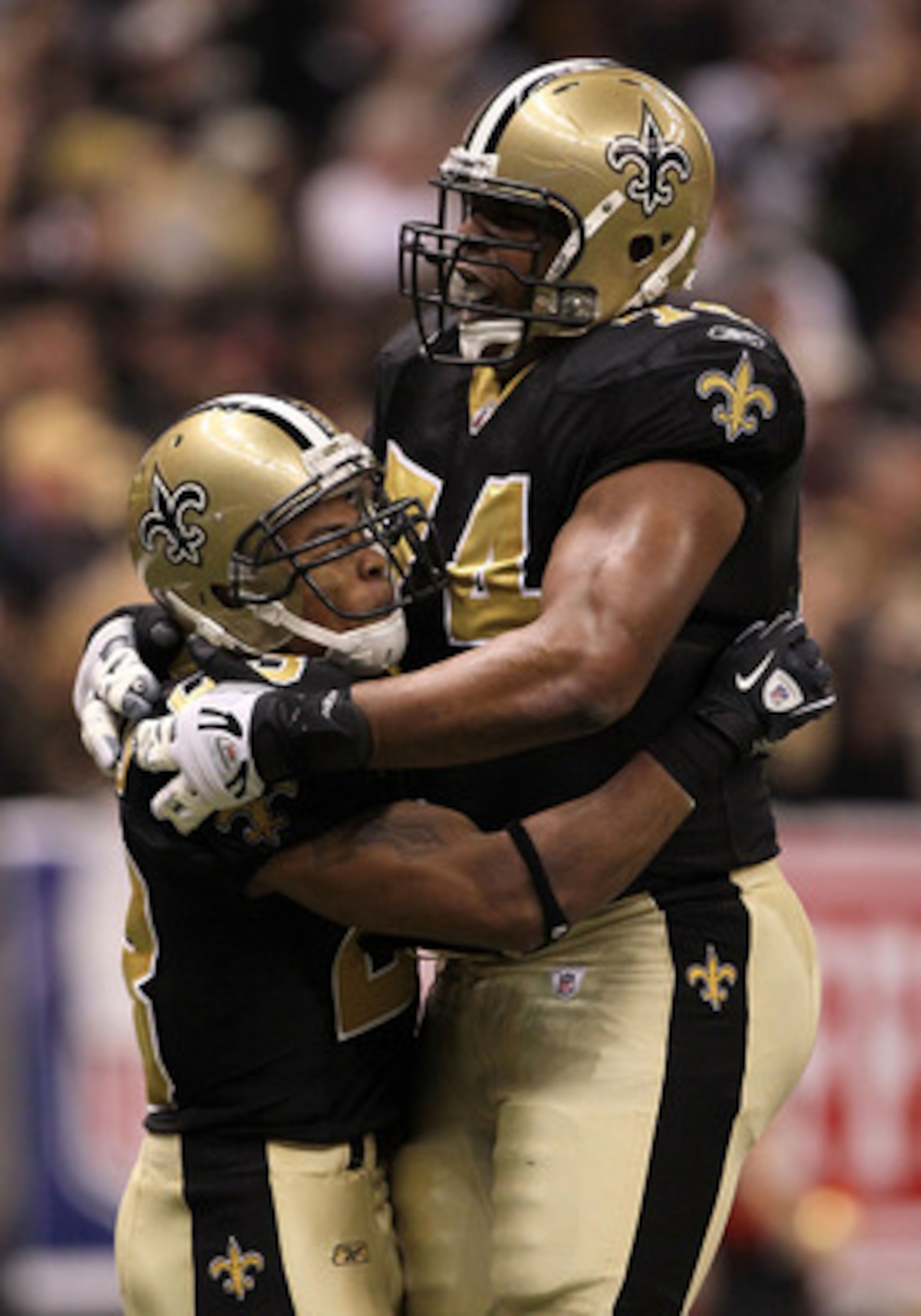 NEW ORLEANS - JANUARY 24: Pierre Thomas #23 of the New Orleans Saints celebrates with teammate Jermon Bushrod #74 after scoring a touchdown on a 38-yard pass play in the first quarter against the Minnesota Vikings during the NFC Championship Game at the NEW ORLEANS - JANUARY 24: Pierre Thomas #23 of the New Orleans Saints celebrates with teammate Jermon Bushrod #74 after scoring a touchdown on a 38-yard pass play in the first quarter against the Minnesota Vikings during the NFC Championship Game at the