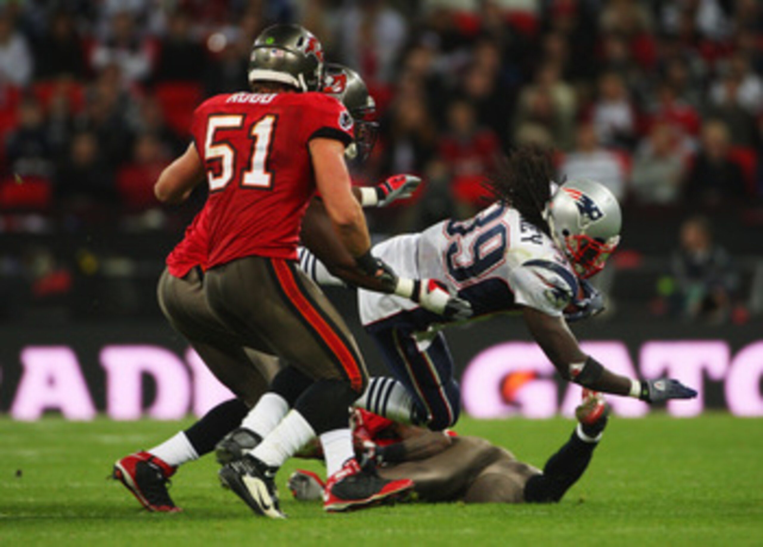 LONDON, ENGLAND - OCTOBER 25: Laurence Maroney (#39) of the New England Patriots is tackled by Barrett Ruud (#51) of Tampa Bay Buccaneers during the NFL International Series match between New England Patriots and Tampa Bay Buccaneers at Wembley Stadium LONDON, ENGLAND - OCTOBER 25: Laurence Maroney (#39) of the New England Patriots is tackled by Barrett Ruud (#51) of Tampa Bay Buccaneers during the NFL International Series match between New England Patriots and Tampa Bay Buccaneers at Wembley Stadium