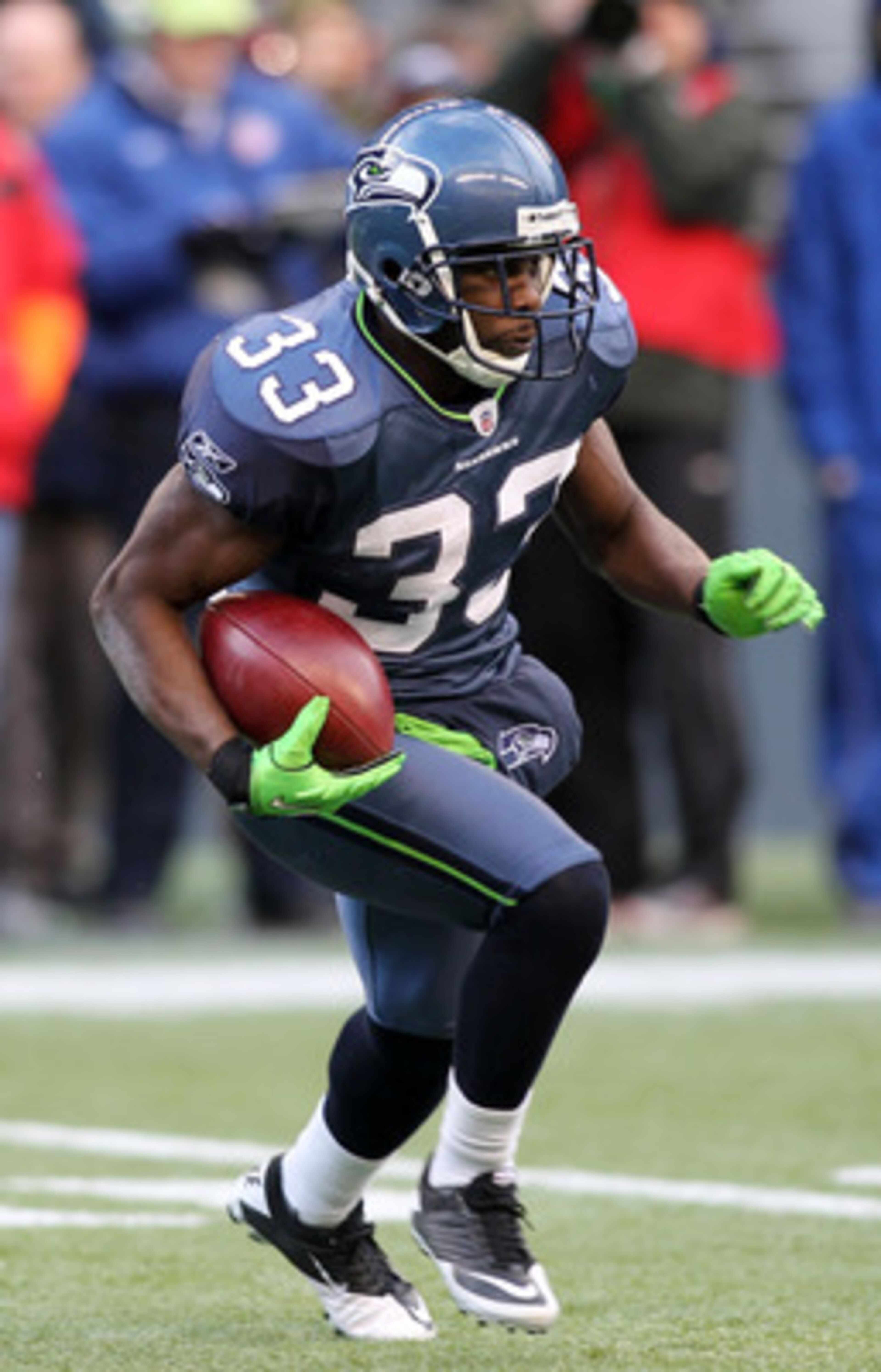 SEATTLE, WA - JANUARY 08:  Leon Washington #33 of the Seattle Seahawks runs down field against the New Orleans Saints during the 2011 NFC wild-card playoff game at Qwest Field on January 8, 2011 in Seattle, Washington.  (Photo by Jonathan Ferrey/Getty Ima