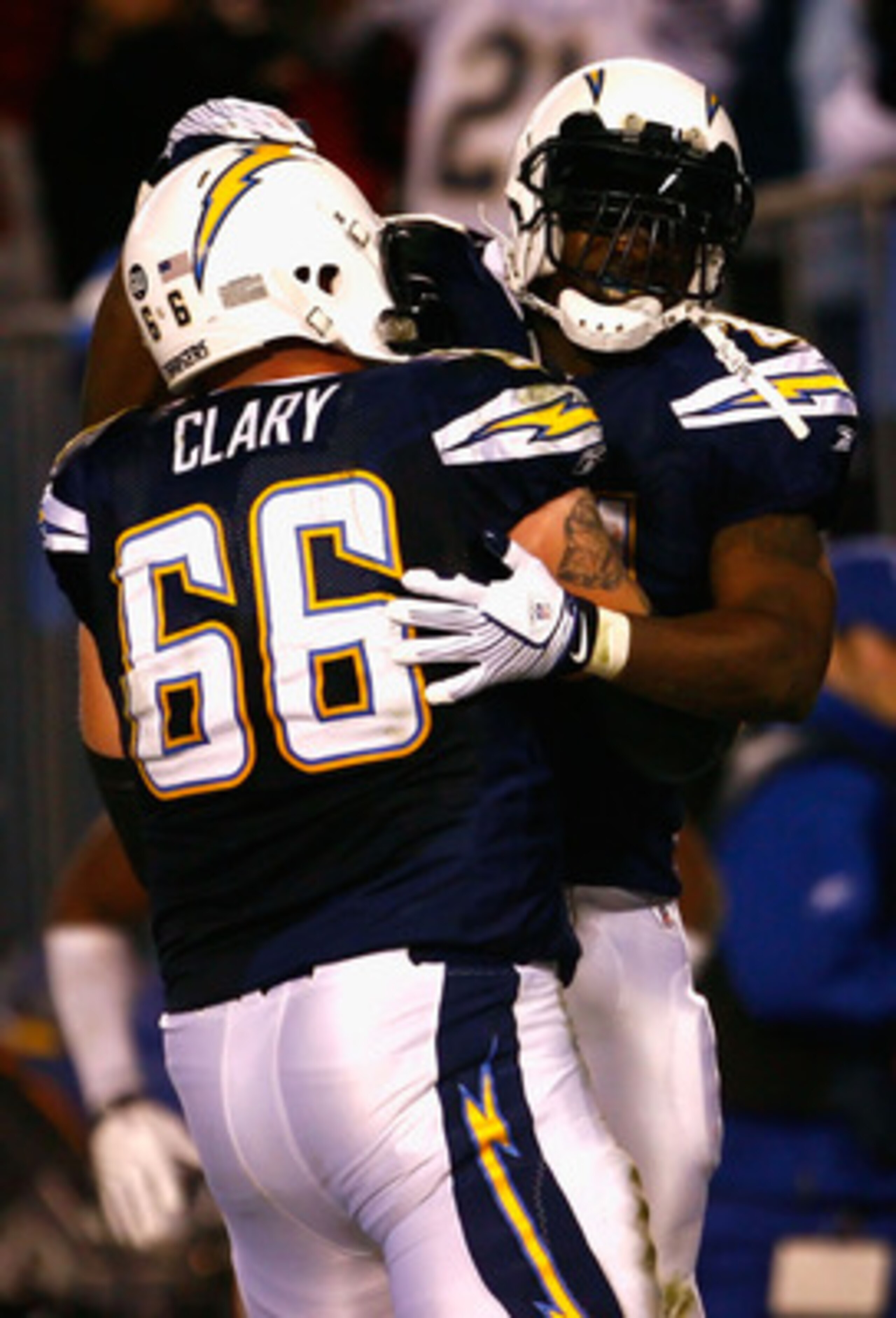SAN DIEGO - DECEMBER 28: Runningback LaDainian Tomlinson #21 of the San Diego Chargers celebrates with teammate Jeromey Clary #66 after Tomlinson scored a 14 yard rushing touchdown against the Denver Broncos during the third quarter of the NFL game at Qu SAN DIEGO - DECEMBER 28: Runningback LaDainian Tomlinson #21 of the San Diego Chargers celebrates with teammate Jeromey Clary #66 after Tomlinson scored a 14 yard rushing touchdown against the Denver Broncos during the third quarter of the NFL game at Qu
