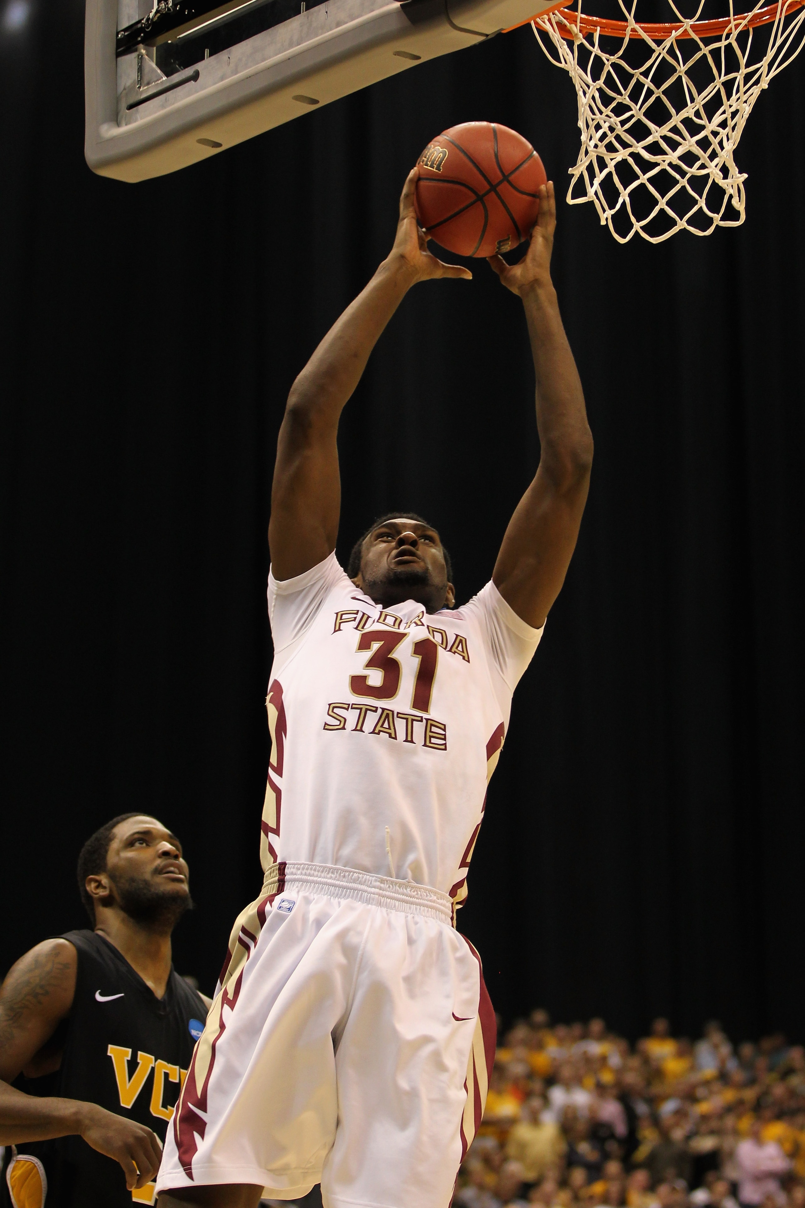 SAN ANTONIO, TX - MARCH 25: Chris Singleton #31 of the Florida State Seminoles goes to the basket against Jamie Skeen #21 of the Virginia Commonwealth Rams during the southwest regional of the 2011 NCAA men's basketball tournament at the Alamodome on Mar SAN ANTONIO, TX - MARCH 25: Chris Singleton #31 of the Florida State Seminoles goes to the basket against Jamie Skeen #21 of the Virginia Commonwealth Rams during the southwest regional of the 2011 NCAA men's basketball tournament at the Alamodome on Mar