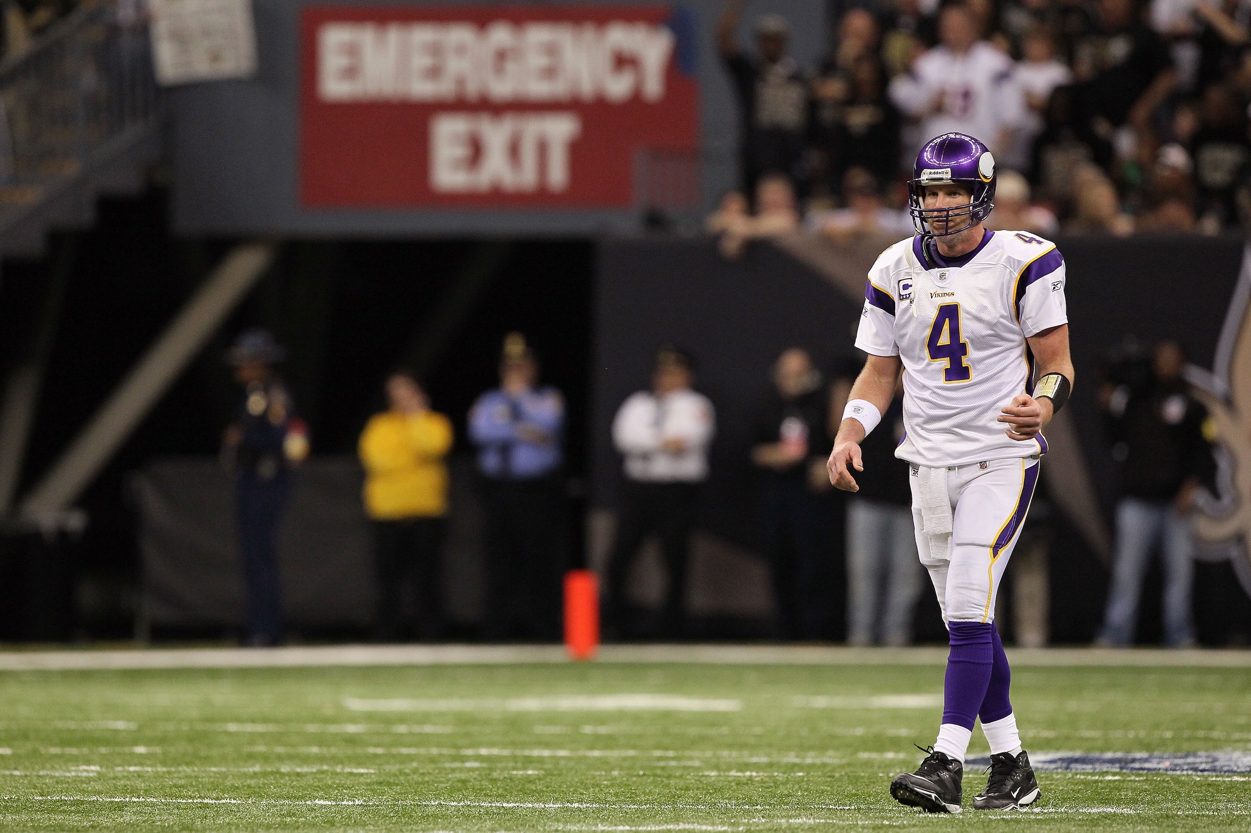 NEW ORLEANS - JANUARY 24:  Brett Favre #4 of the Minnesota Vikings walks on the field under a sign which reads 'Emergency Exit' against the New Orleans Saints during the NFC Championship Game at the Louisiana Superdome on January 24, 2010 in New Orleans,