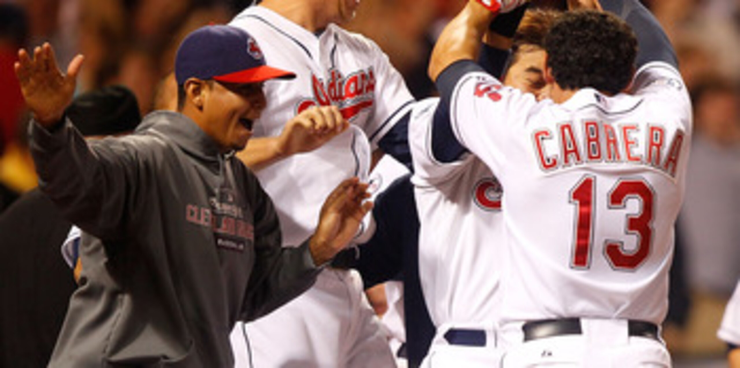 CLEVELAND - MAY 13:  Shin-Soo Choo #17, Asdrubal Cabrera #13, and Shelley Duncan #47 of the Cleveland Indians celebrate following the walk-off two run home run by Travis Hafner #48 against the Seattle Mariners during the game on May 13, 2011 at Progressiv