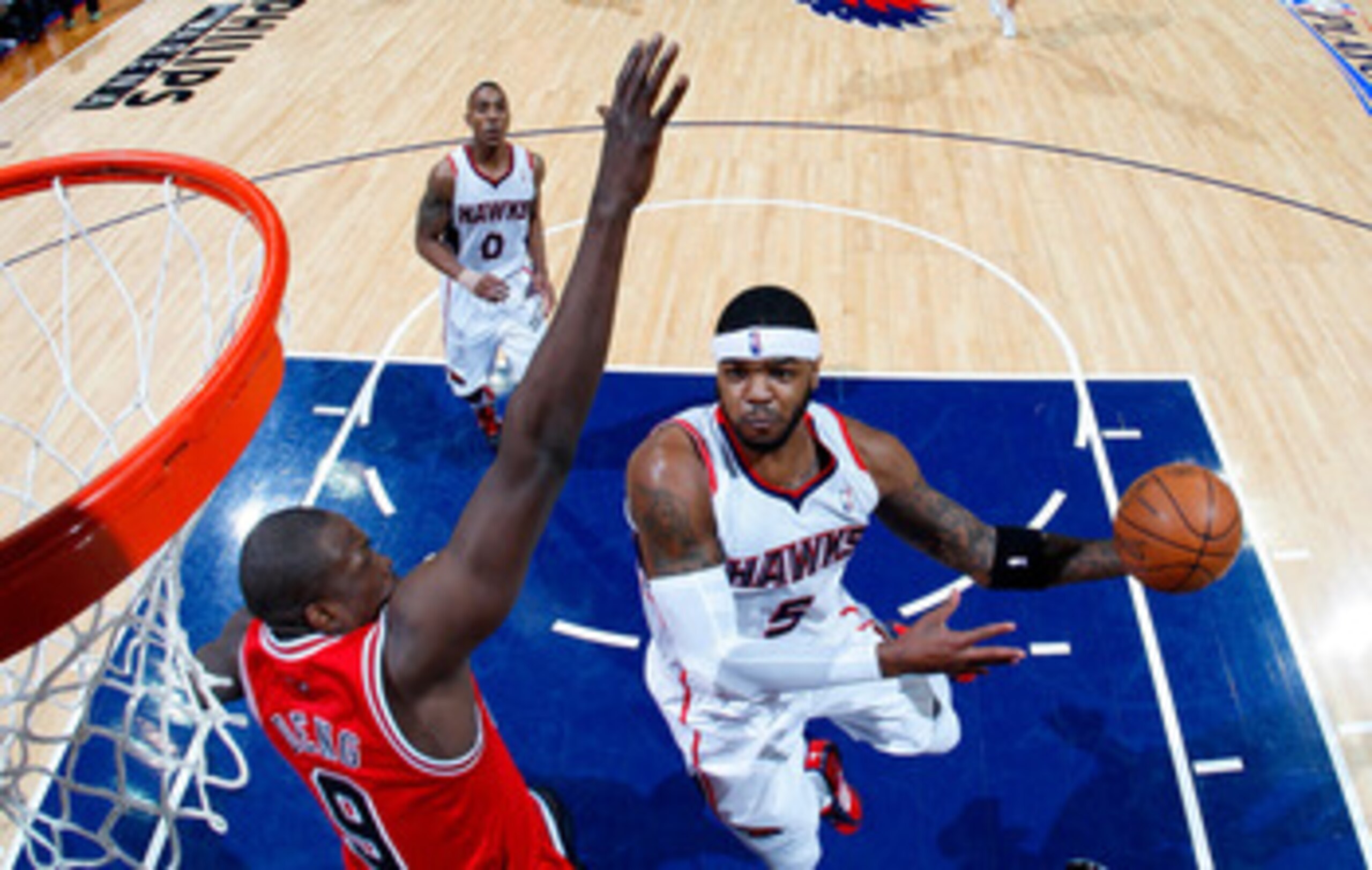 ATLANTA, GA - MAY 12:  Josh Smith #5 of the Atlanta Hawks drives against Luol Deng #9 of the Chicago Bulls in Game Six of the Eastern Conference Semifinals in the 2011 NBA Playoffs at Phillips Arena on May 12, 2011 in Atlanta, Georgia.  NOTE TO USER: User