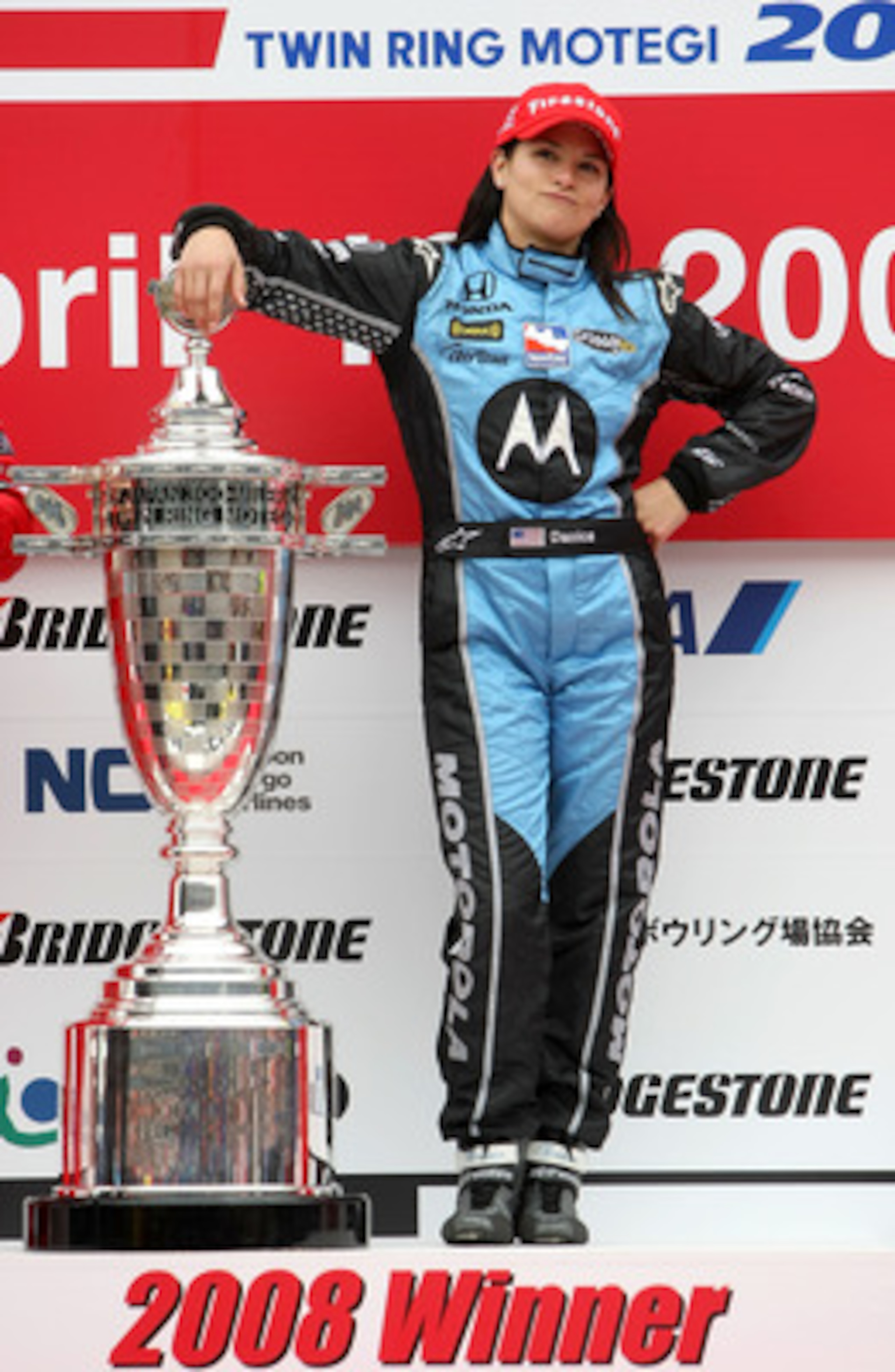 MOTEGI, JAPAN - APRIL 20:  Danica Patrick driver of the #7 Motorola Andretti Green Racing Honda Dallara poses with the trophy after winning the IndyCar Series Bridgestone Indy Japan 300 Mile on April 20, 2008 at Twin Ring Motegi in Motegi, Japan.  (Photo 