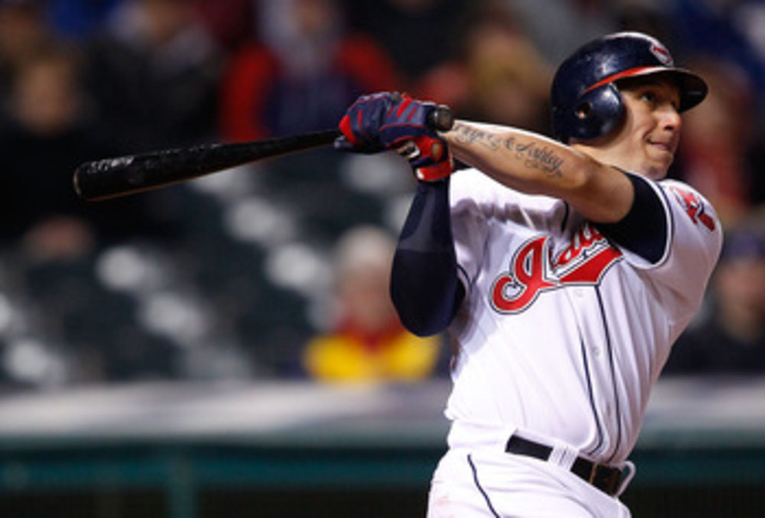 CLEVELAND - APRIL 06:  Asdrubal Cabrera #13 of the Cleveland Indians hits a three run home run against he Boston Red Sox during the game on April 6, 2011 at Progressive Field in Cleveland, Ohio.  (Photo by Jared Wickerham/Getty Images)