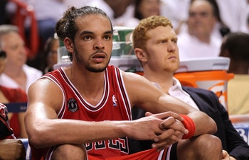 MIAMI, FL - MAY 22:  Joakim Noah #13 (L) and Brian Scalabrine #24 of the Chicago Bulls look on dejected from the bench late in the fourth quarter against the Miami Heat in Game Three of the Eastern Conference Finals during the 2011 NBA Playoffs on May 22,