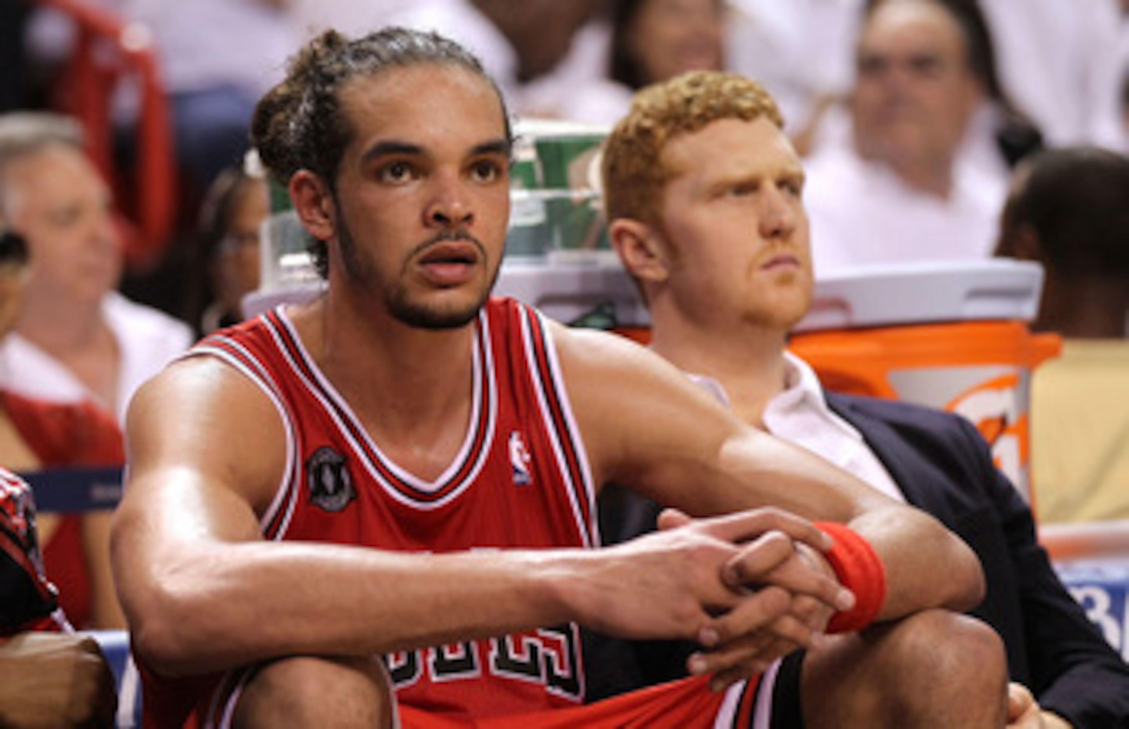MIAMI, FL - MAY 22:  Joakim Noah #13 (L) and Brian Scalabrine #24 of the Chicago Bulls look on dejected from the bench late in the fourth quarter against the Miami Heat in Game Three of the Eastern Conference Finals during the 2011 NBA Playoffs on May 22,