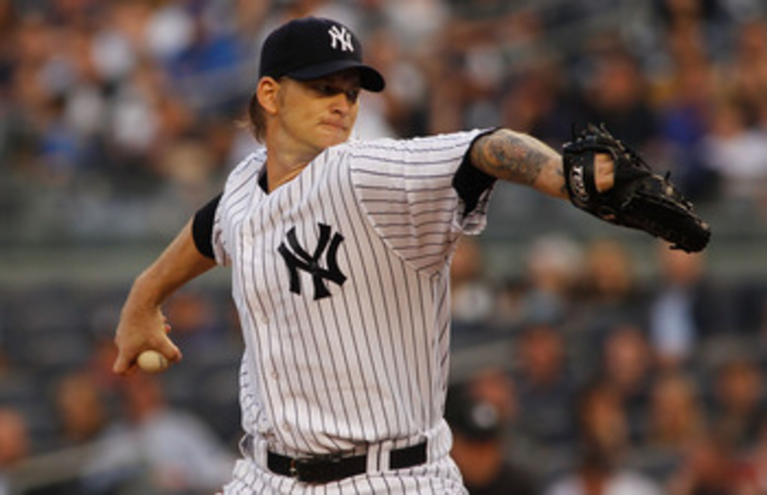 NEW YORK - MAY 21:  A.J. Burnett #34 of the New York Yankees delivers a pitch in the first inning against the New York Mets on May 21, 2011 at Yankee Stadium in the Bronx borough of New York City.  (Photo by Mike Stobe/Getty Images)