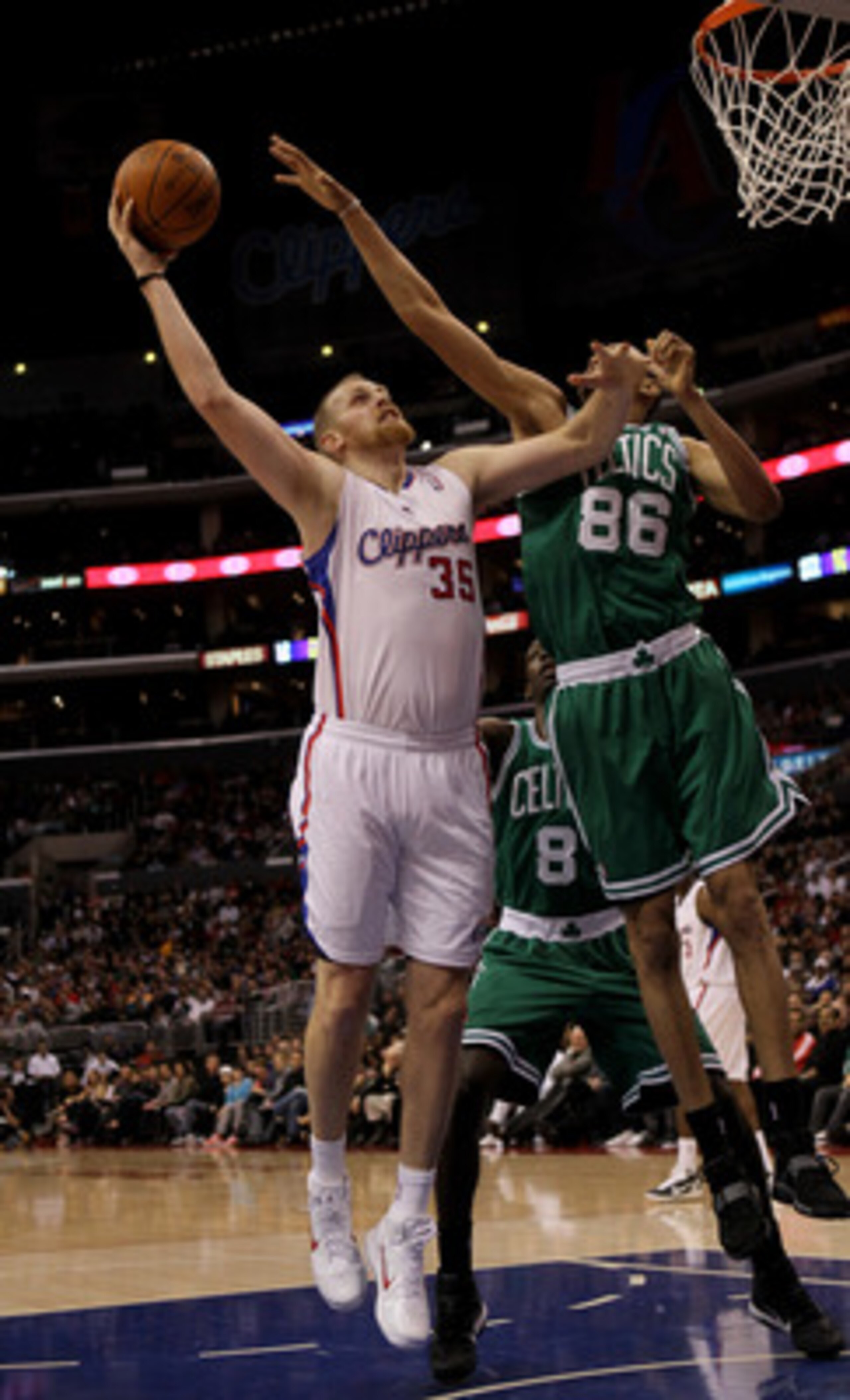 LOS ANGELES, CA - FEBRUARY 26:  Chris Kaman #35 of the Los Angeles Clippers shoots over Chris Johnson #86 of he Boston Celtics at Staples Center on February 26, 2011  in Los Angeles, California.  NOTE TO USER: User expressly acknowledges and agrees that, 