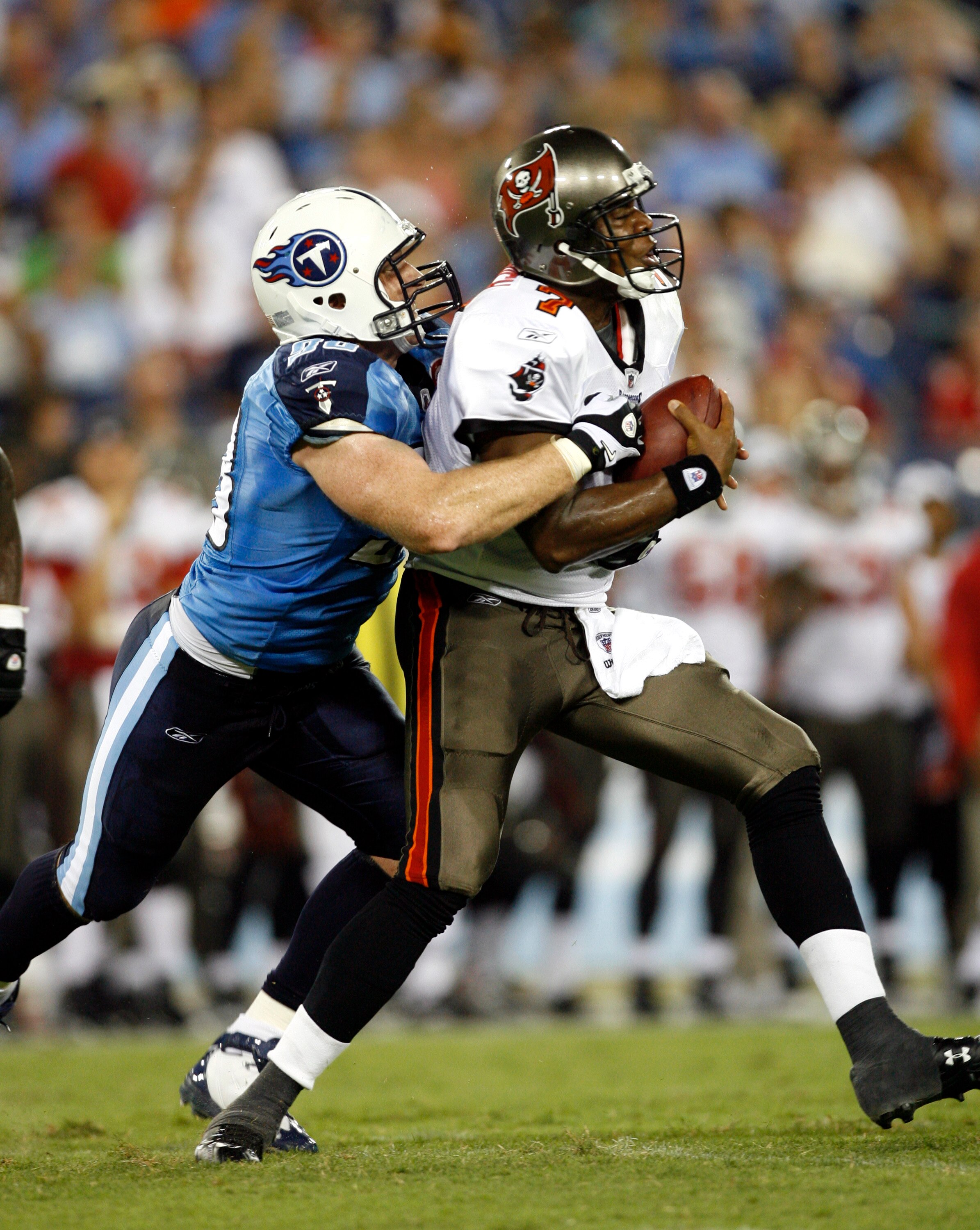 NASHVILLE, TN - AUGUST 15: Dave Ball #98 of the Tennessee Titans attempts to tackle Byron Leftwich #7 of the Tampa Bay Buccaneers, but he evades the tackle during a preseason NFL game at LP Field on August 15, 2009 in Nashville, Tennessee. (Photo by Joe M