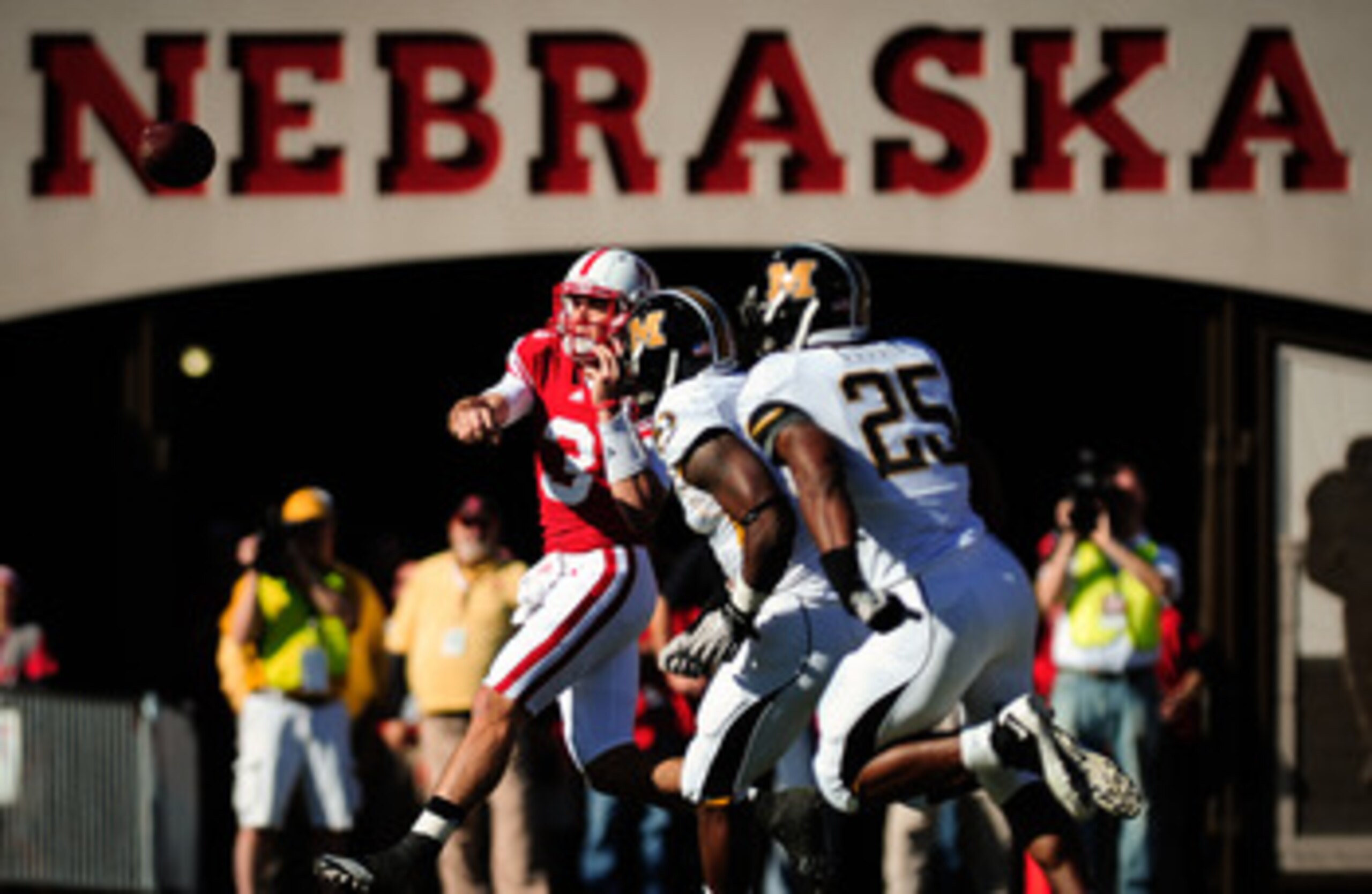 LINCOLN, NE - OCTOBER 30: Quarterback Taylor Martinez #3 of the Nebraska Cornhuskers throws over the Missouri Tigers defense during first half action of their game at Memorial Stadium on October 30, 2010 in Lincoln, Nebraska. Nebraska Defeated Missouri 31
