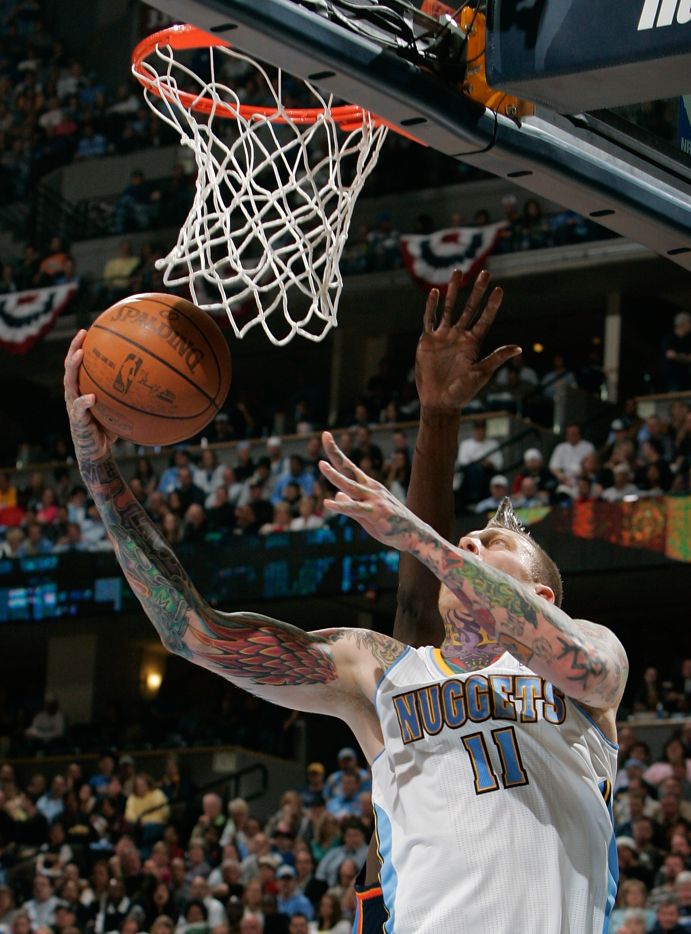 DENVER, CO - APRIL 23:  Chris Andersen #11 of the Denver Nuggets scores a basket agains the Oklahoma City Thunder in Game Three of the Western Conference Quarterfinals in the 2011 NBA Playoffs at Pepsi Center on April 23, 2011 in Denver, Colorado. NOTE TO