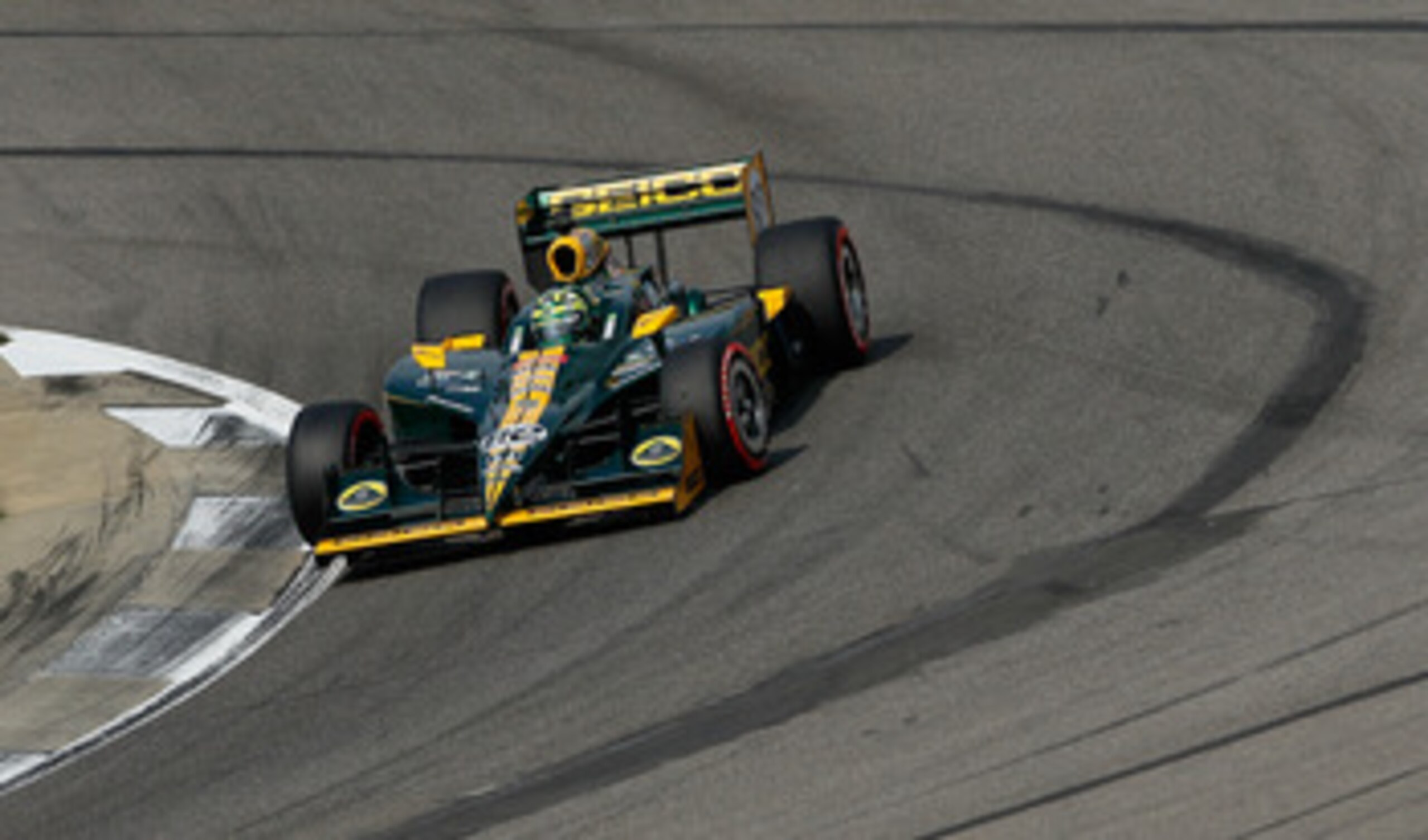 BIRMINGHAM, AL - APRIL 09:  Tony Kanaan of Brazil, driver of the #82 KV Racing Technology-Lotus Dallara Honda, drives during qualifying for the IndyCar Series Honda Indy Grand Prix of Alabama at Barber Motorsports Park on April 9, 2011 in Birmingham, Alab