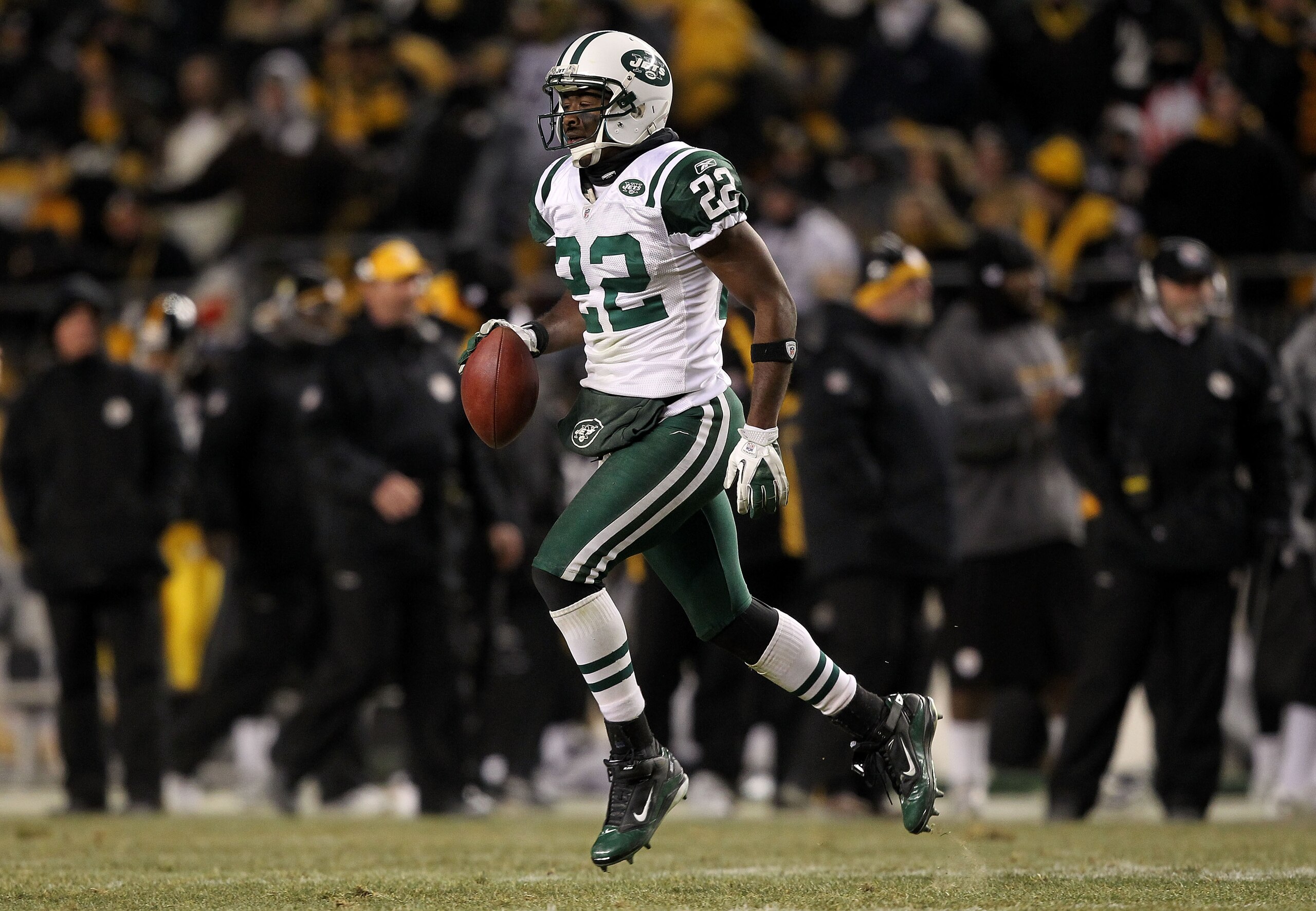 PITTSBURGH, PA - JANUARY 23:  Brodney Pool #22 of the New York Jets runs down field after intercepting a pass intended for Emmanuel Sanders #88 of the Pittsburgh Steelers in the third quarter of the 2011 AFC Championship game at Heinz Field on January 23,